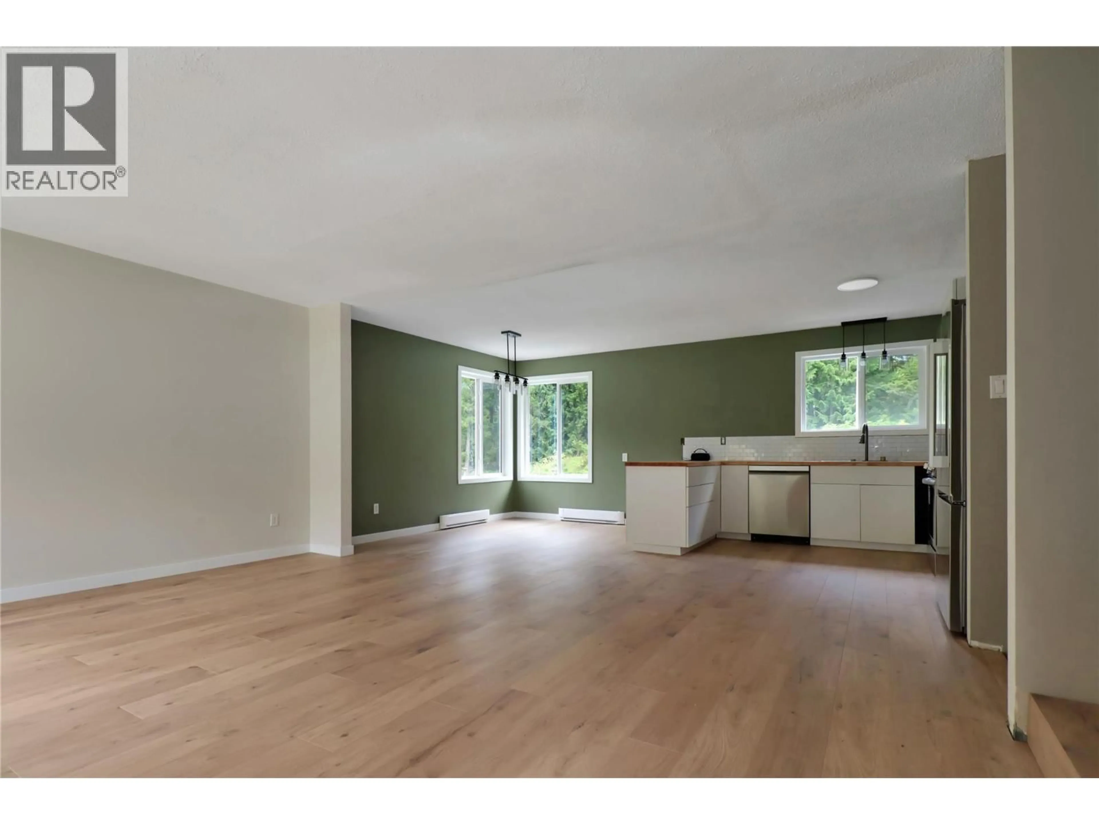 Open concept kitchen, wood/laminate floor for 208 SCHMIDT ROAD, Clearwater British Columbia V0E1N2