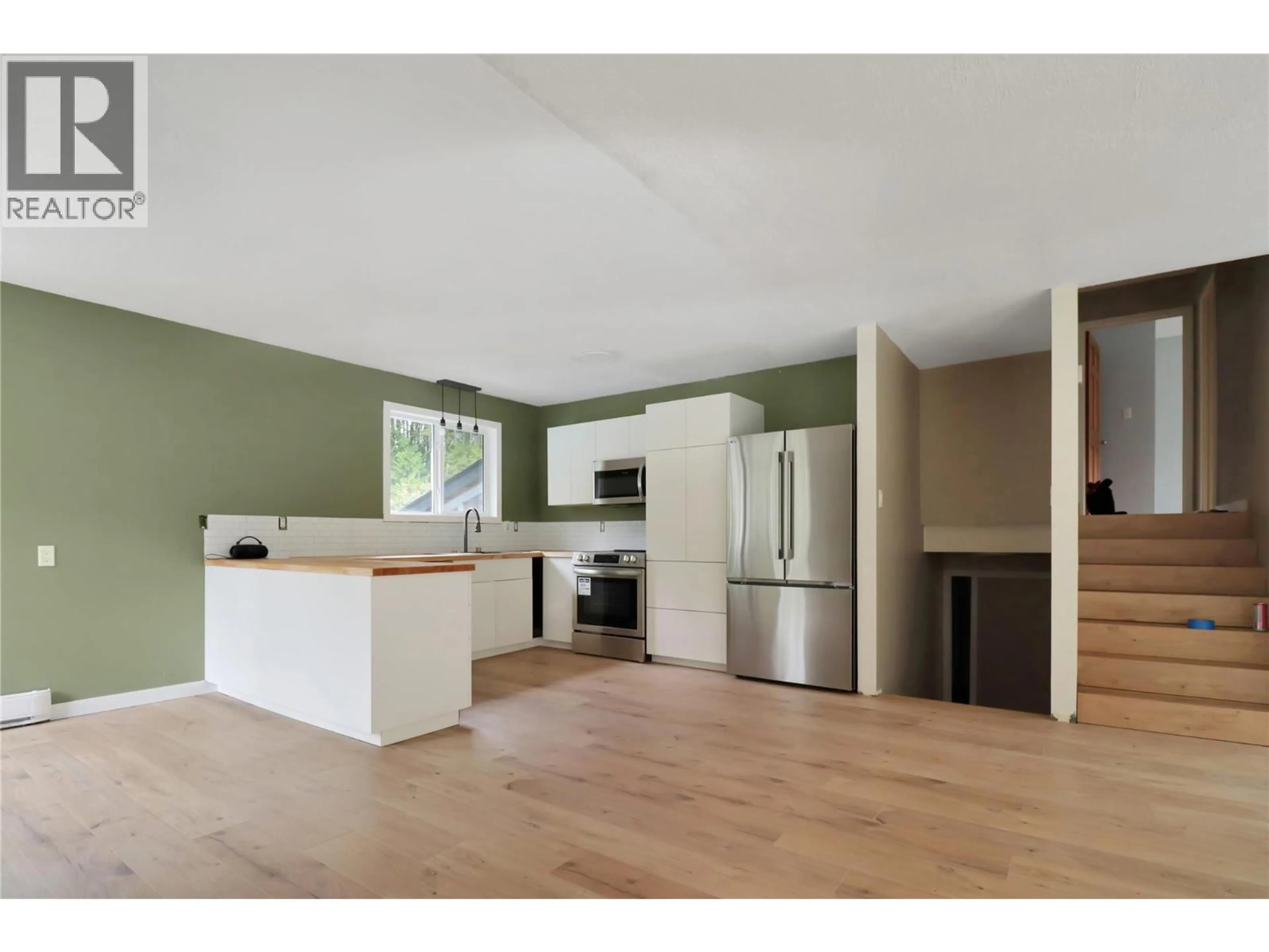 Open concept kitchen, wood/laminate floor for 208 SCHMIDT ROAD, Clearwater British Columbia V0E1N2