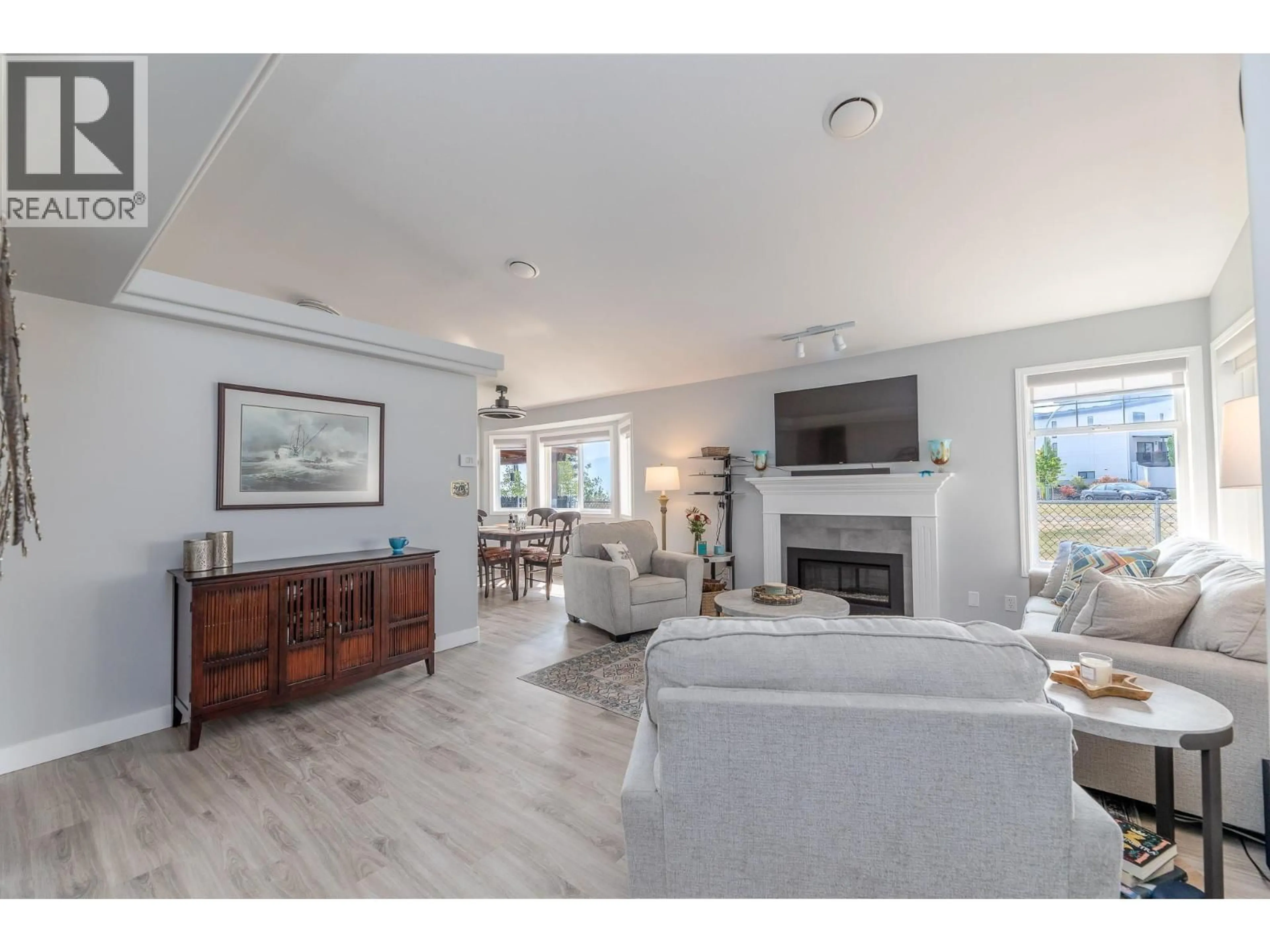 Living room with furniture, wood/laminate floor for 3689 MORNINGSIDE DRIVE, West Kelowna British Columbia V4T2T8