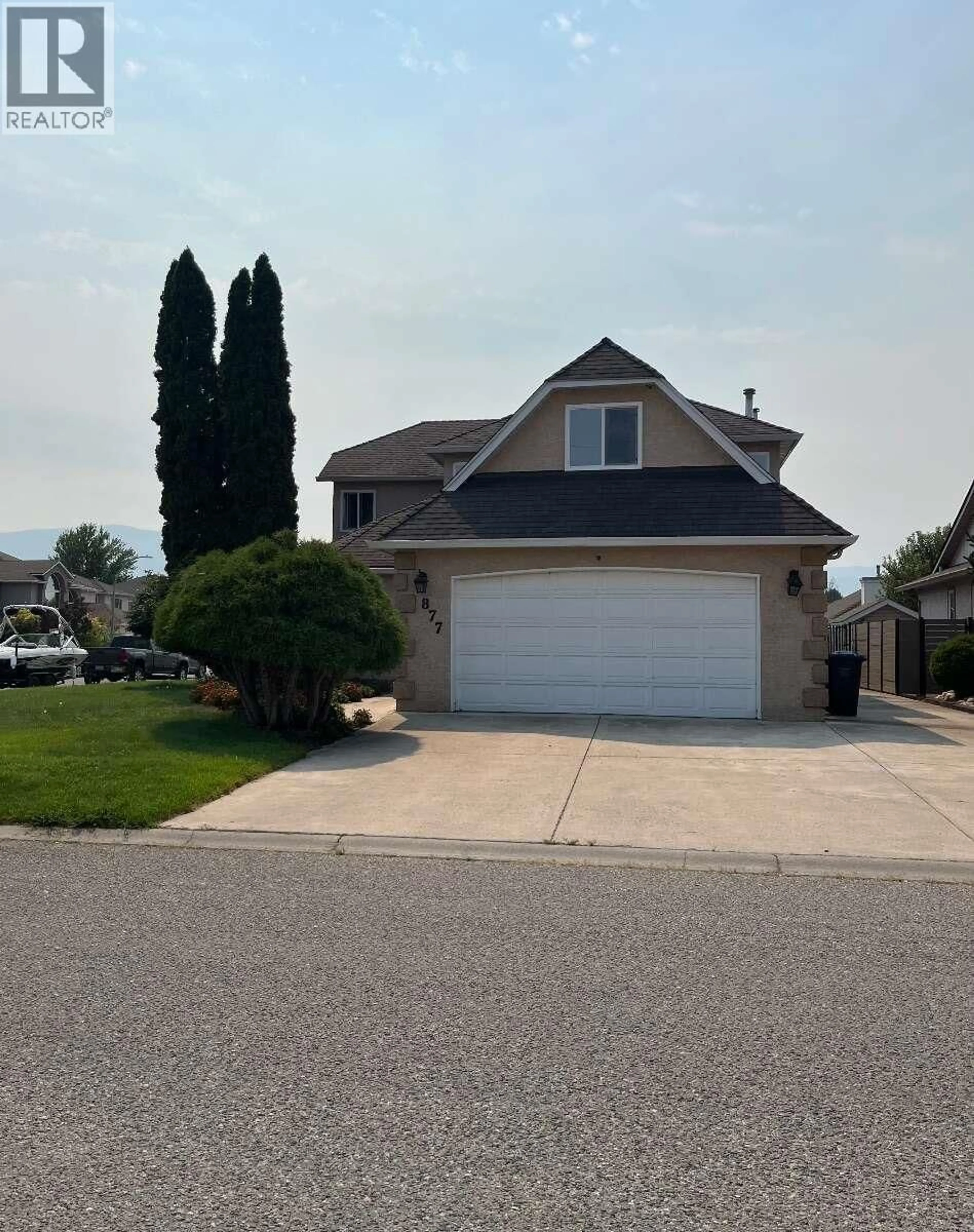 Home with vinyl exterior material, street for 877 SPRINGSIDE COURT, Kelowna British Columbia V1W3L8