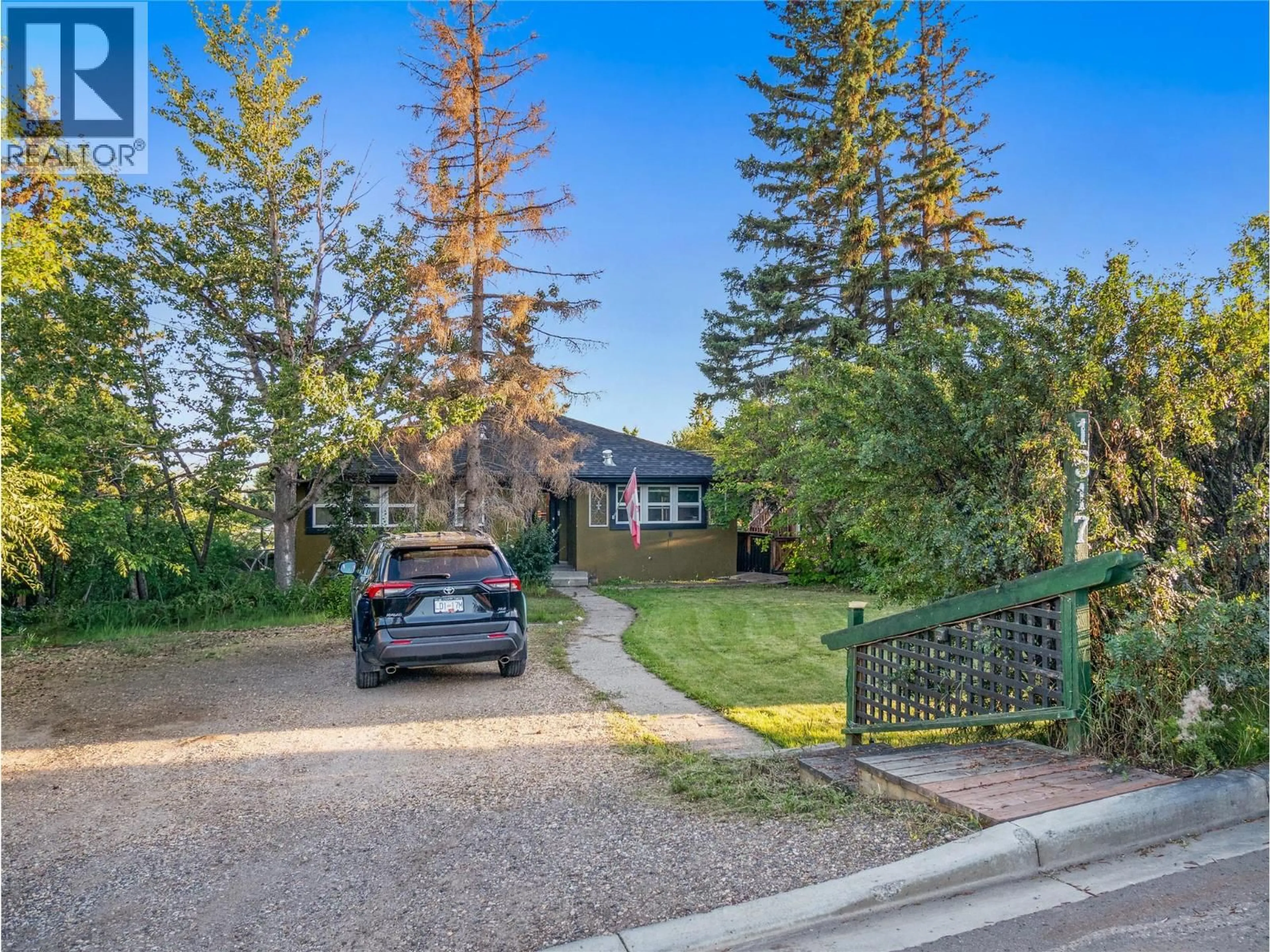 A pic from outside/outdoor area/front of a property/back of a property/a pic from drone, street for 1517 94 AVENUE, Dawson Creek British Columbia V1G1H2