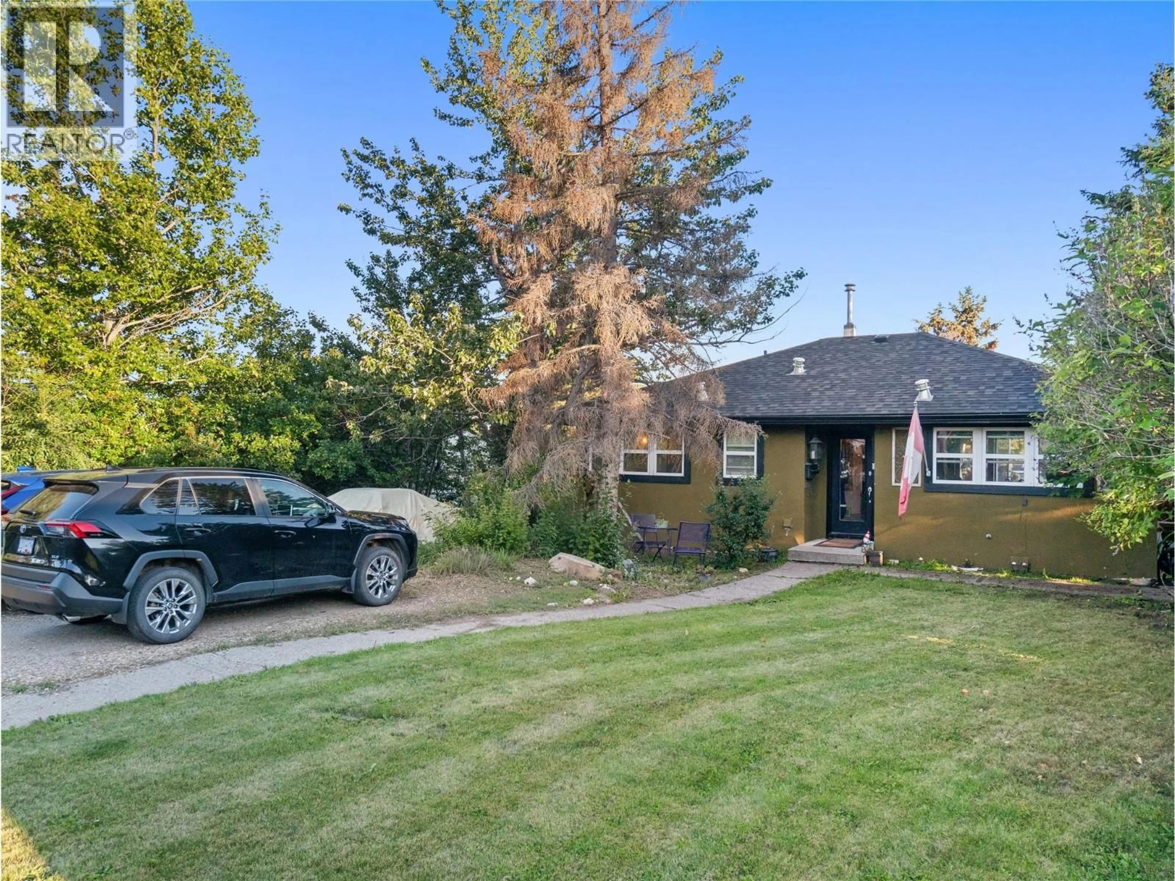 A pic from outside/outdoor area/front of a property/back of a property/a pic from drone, street for 1517 94 AVENUE, Dawson Creek British Columbia V1G1H2