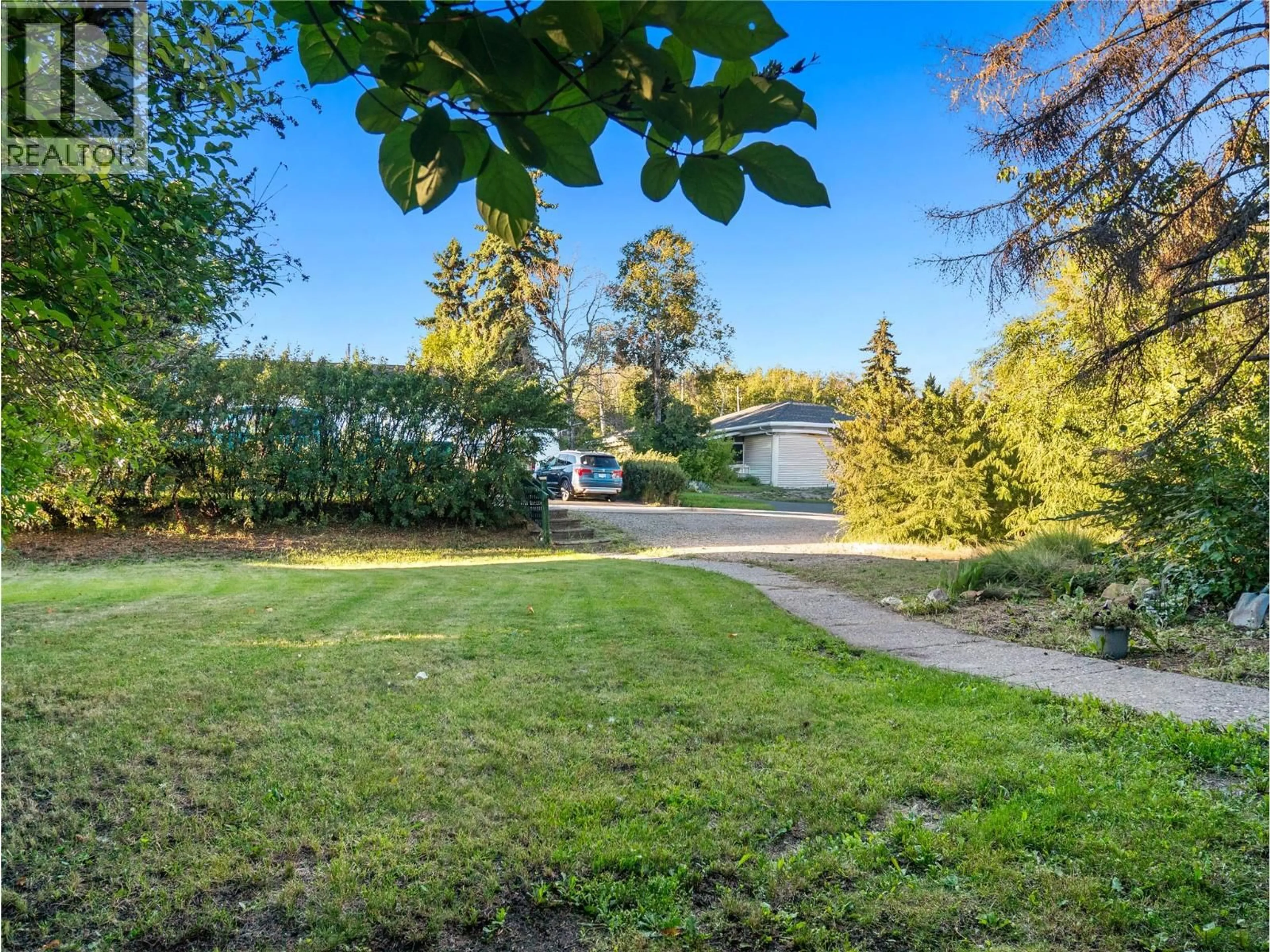 A pic from outside/outdoor area/front of a property/back of a property/a pic from drone, street for 1517 94 AVENUE, Dawson Creek British Columbia V1G1H2