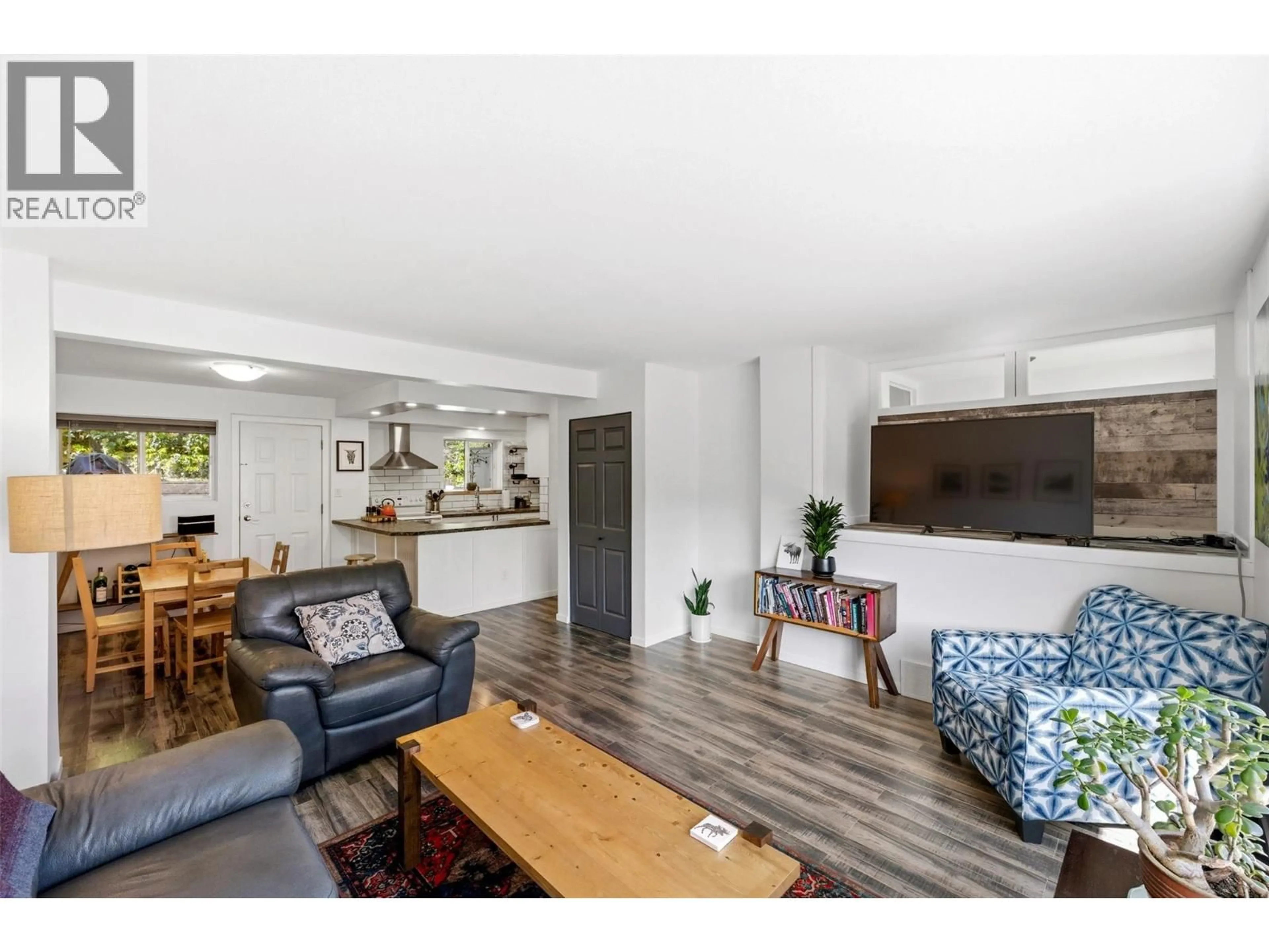 Living room with furniture, wood/laminate floor for 189 - 1458 PENTICTON AVENUE, Penticton British Columbia V2A8L3