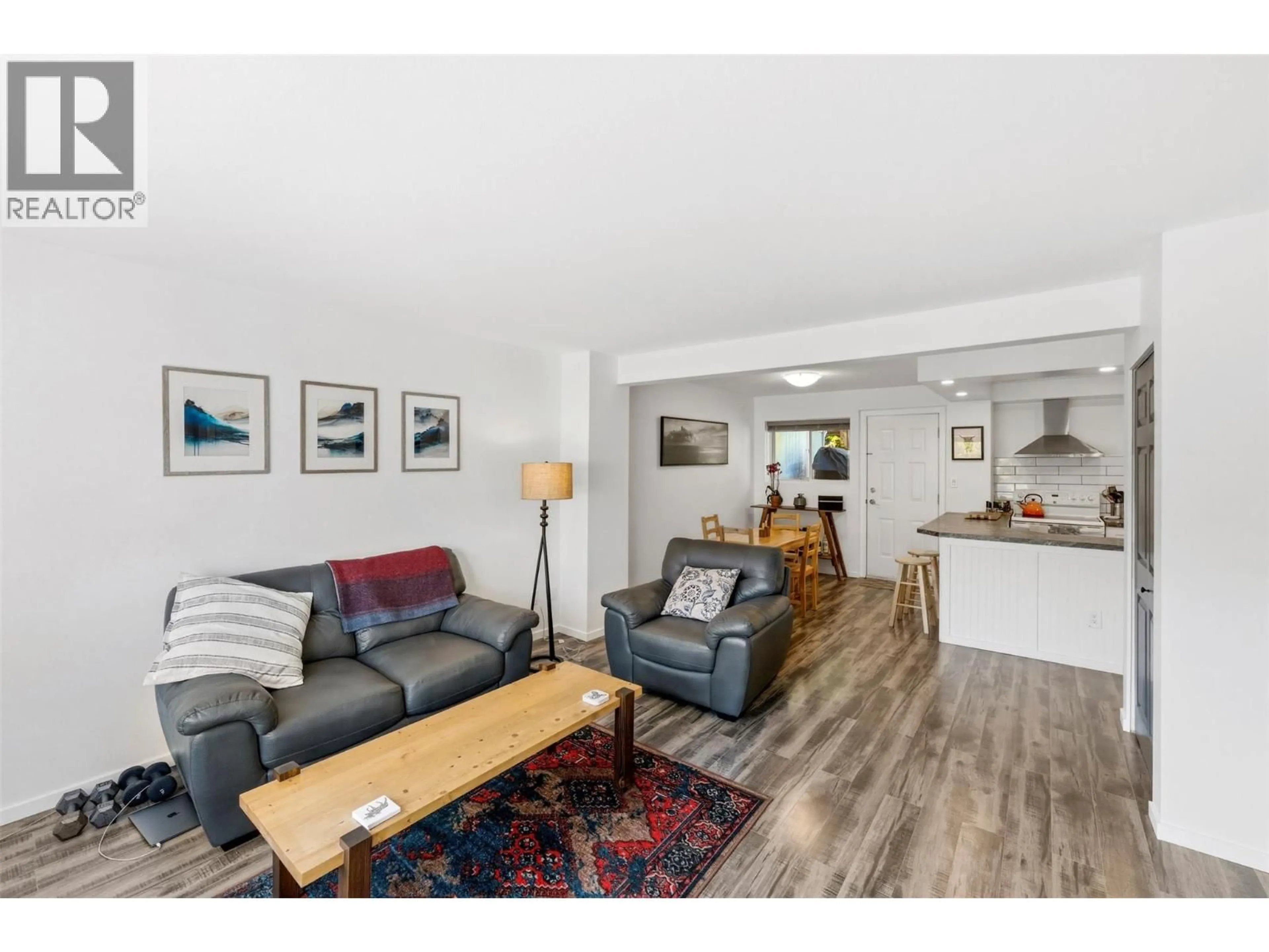 Living room with furniture, wood/laminate floor for 189 - 1458 PENTICTON AVENUE, Penticton British Columbia V2A8L3