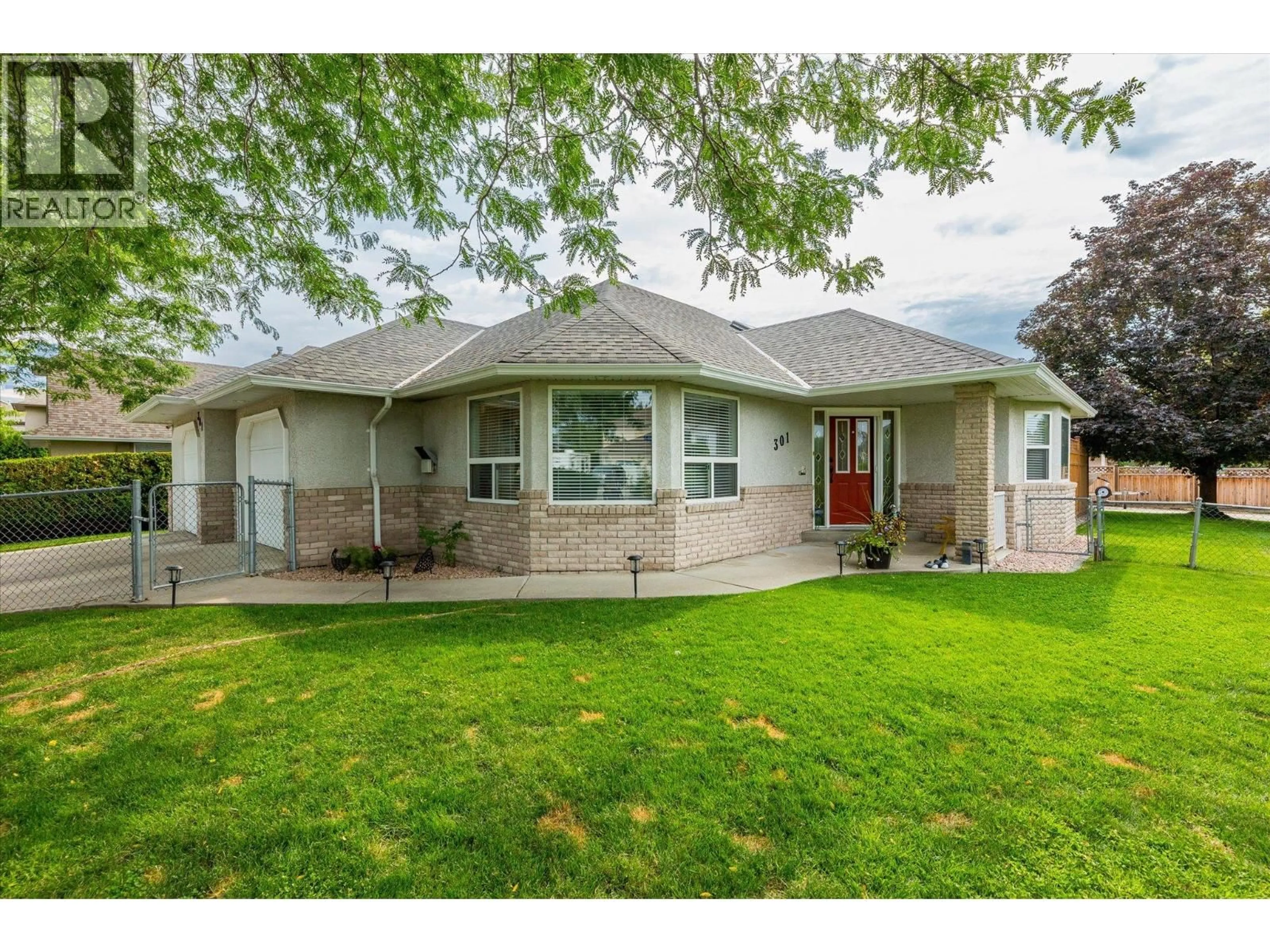 Home with vinyl exterior material, street for 301 FIZET AVENUE, Kelowna British Columbia V1X7P5