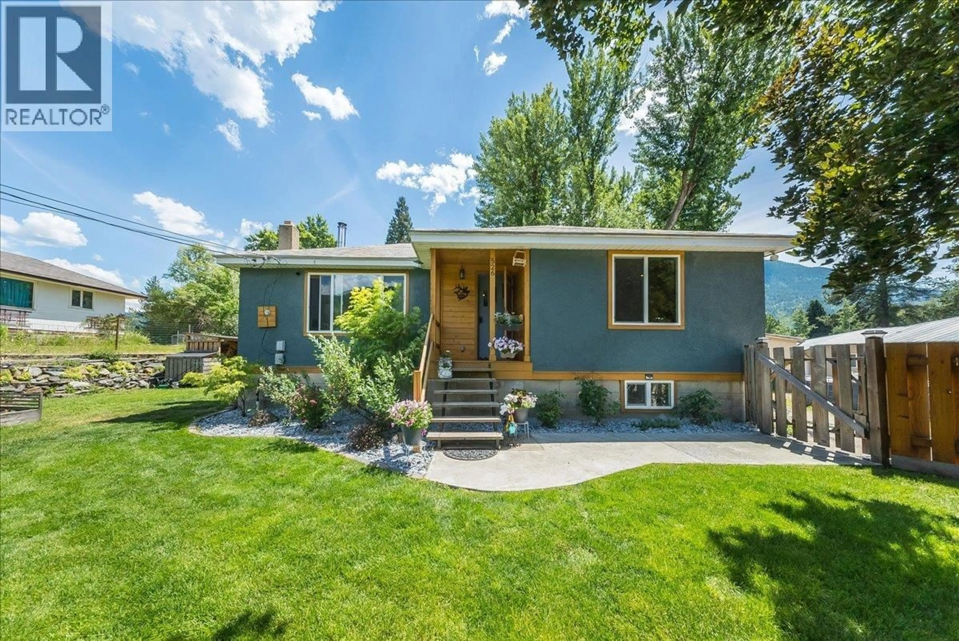 Home with vinyl exterior material, street for 526 12TH AVENUE, Genelle British Columbia V0G1G0