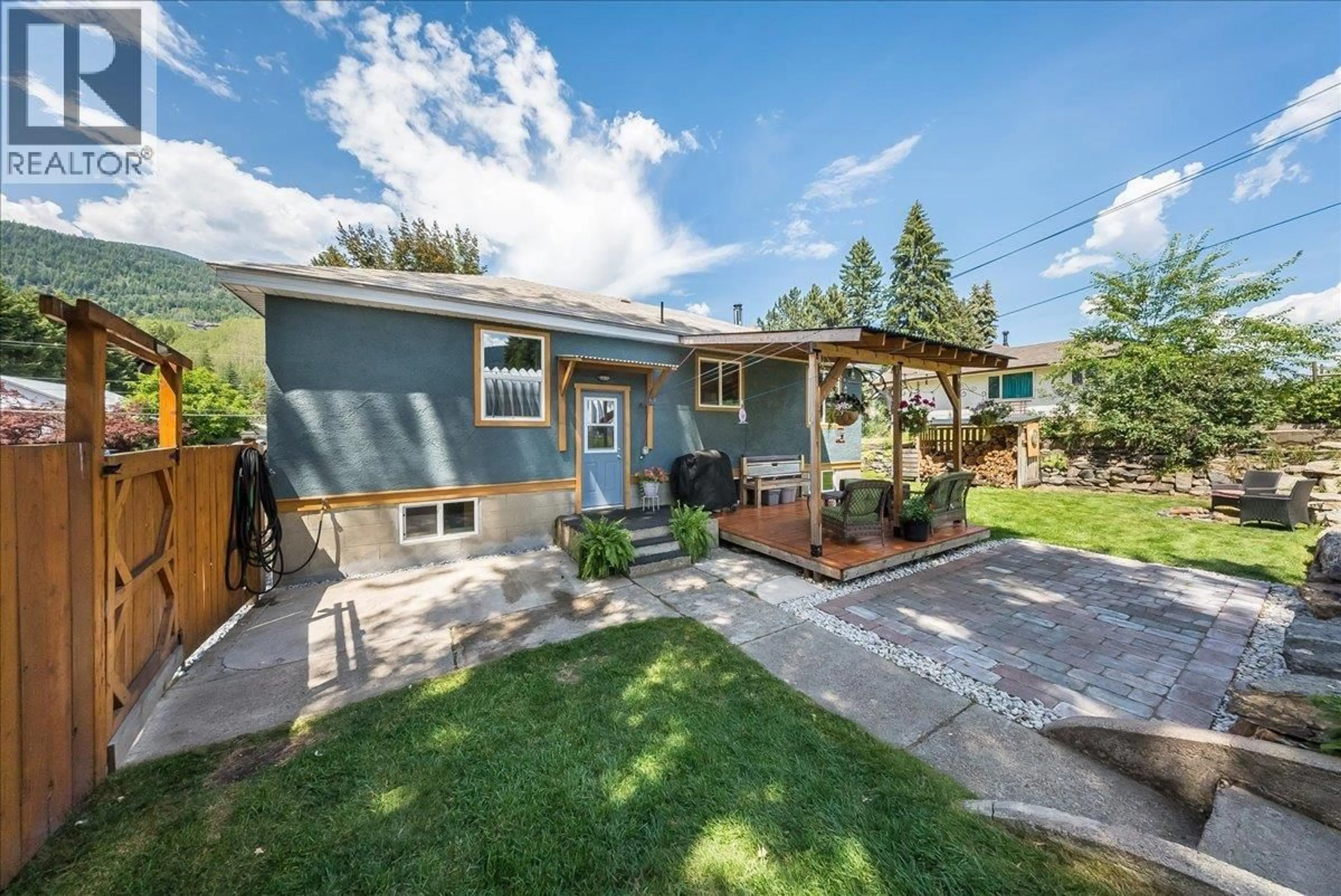 A pic from outside/outdoor area/front of a property/back of a property/a pic from drone, street for 526 12TH AVENUE, Genelle British Columbia V0G1G0