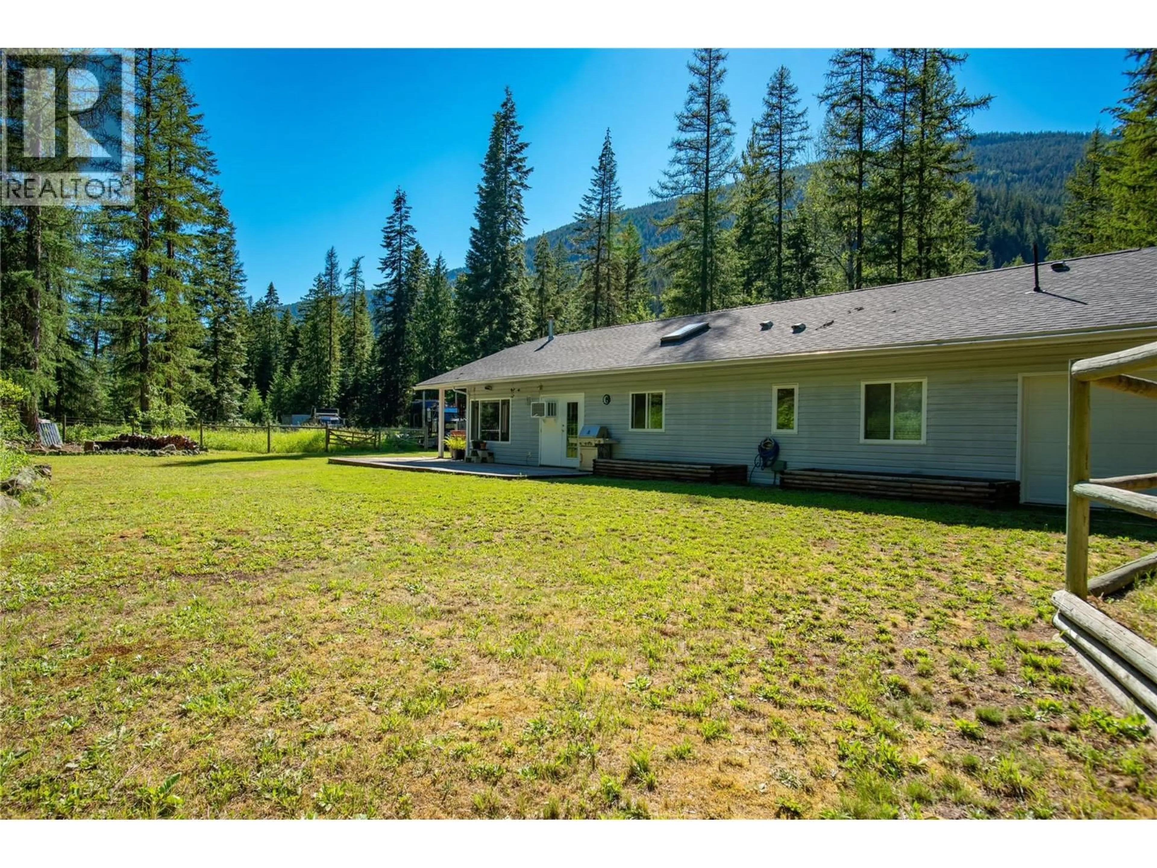 A pic from outside/outdoor area/front of a property/back of a property/a pic from drone, mountain view for 2222 JENISA ROAD, Castlegar British Columbia V1N2L8
