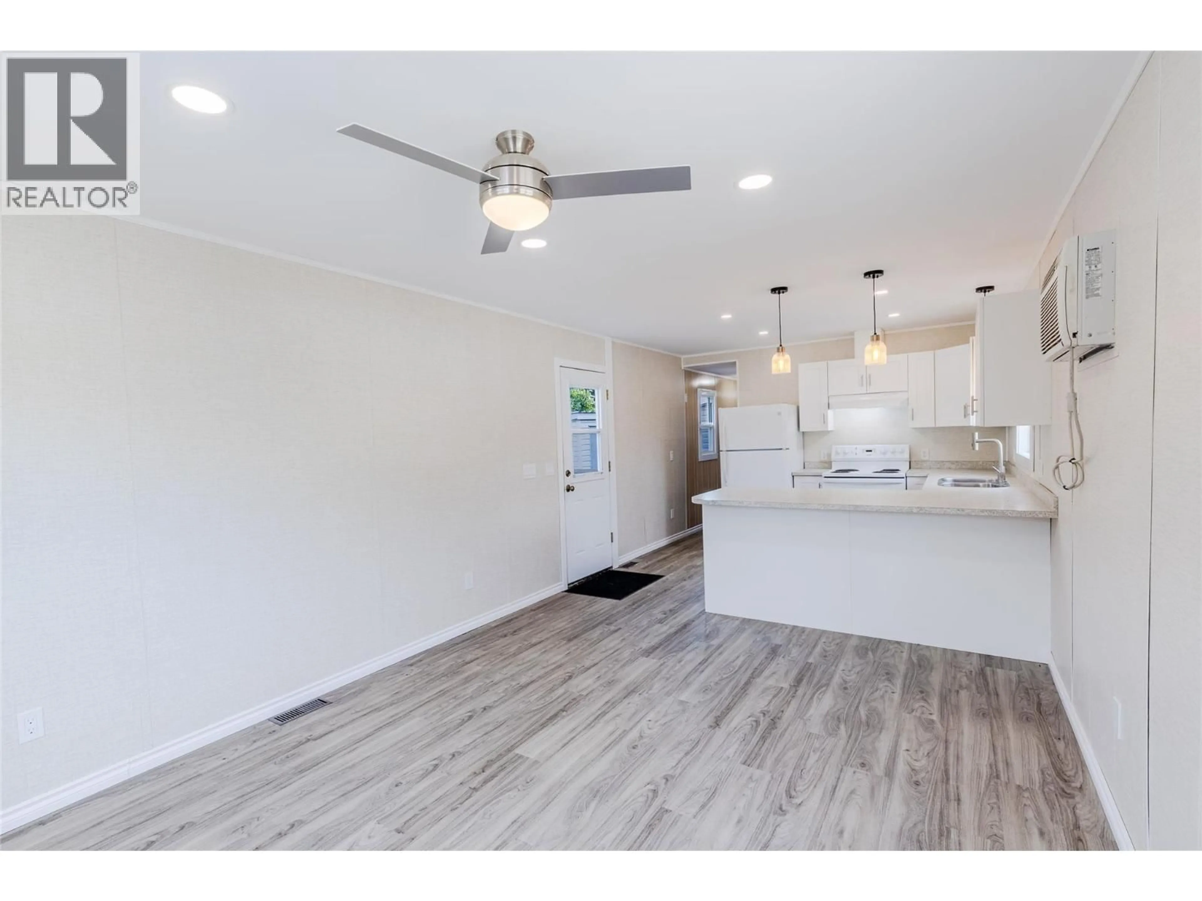 Open concept kitchen, wood/laminate floor for 21 - 1421 ERICKSON ROAD, Creston British Columbia V0B1G1