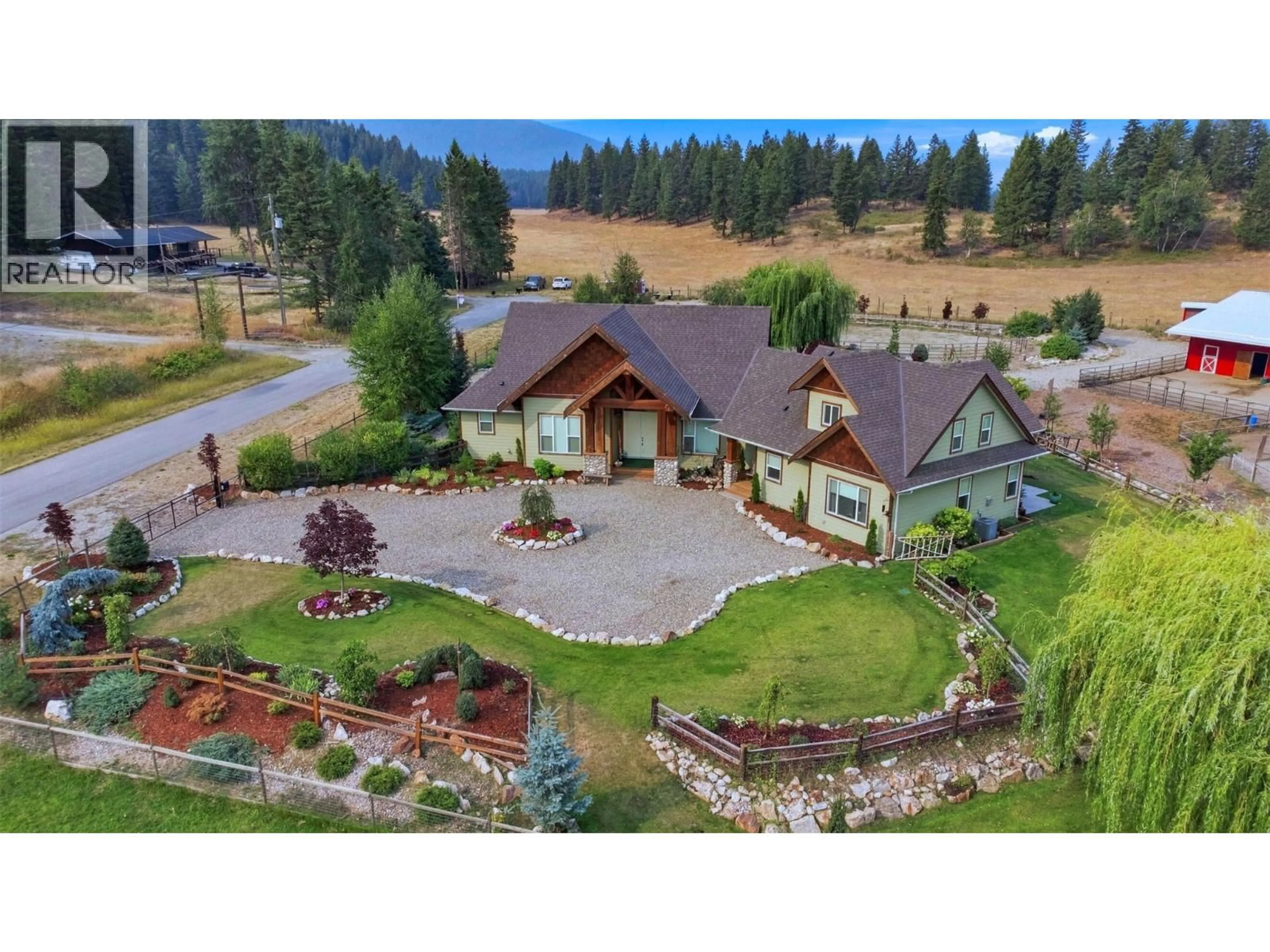 A pic from outside/outdoor area/front of a property/back of a property/a pic from drone, mountain view for 88 WESTWOOD ROAD, Lumby British Columbia V0E2G1