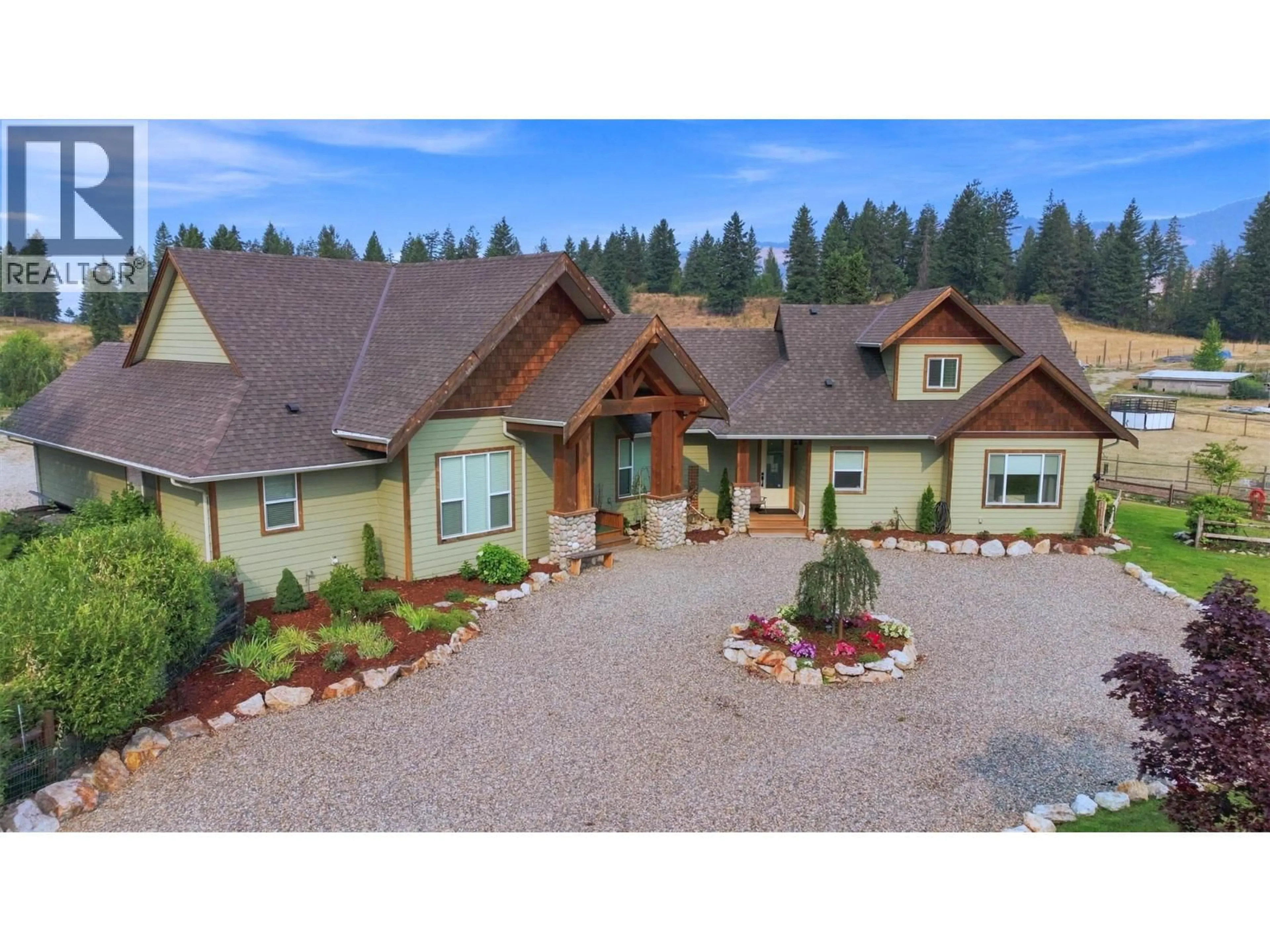 A pic from outside/outdoor area/front of a property/back of a property/a pic from drone, mountain view for 88 WESTWOOD ROAD, Lumby British Columbia V0E2G1