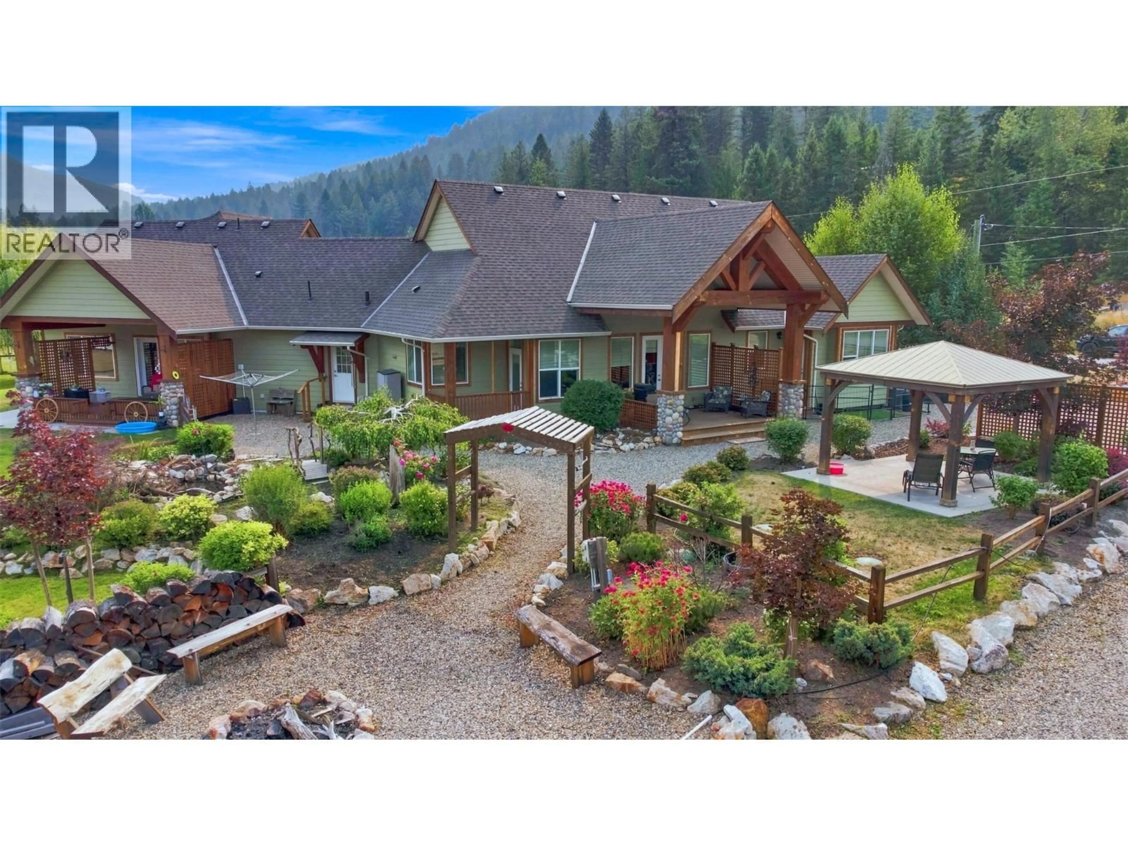 A pic from outside/outdoor area/front of a property/back of a property/a pic from drone, mountain view for 88 WESTWOOD ROAD, Lumby British Columbia V0E2G1