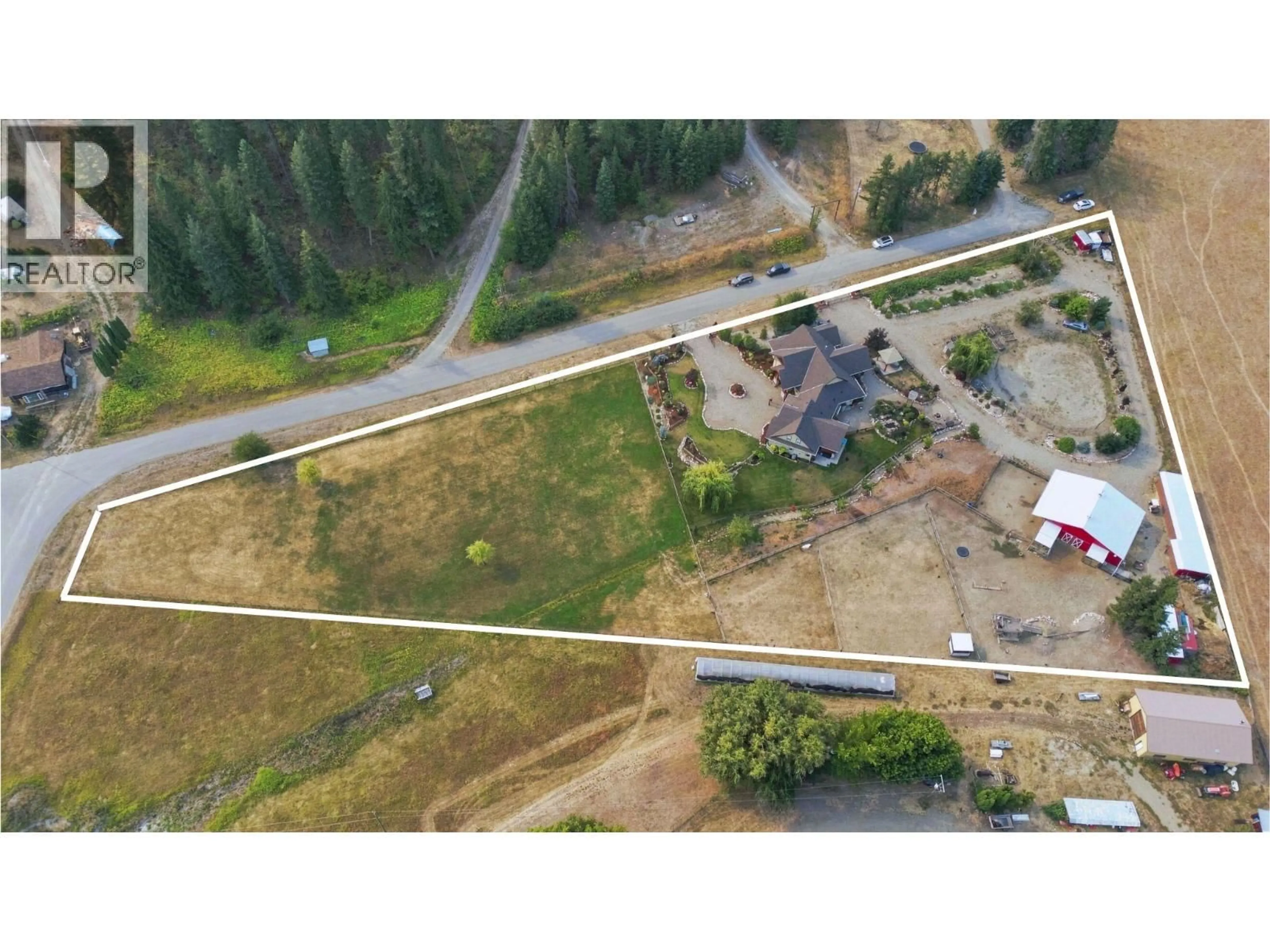 A pic from outside/outdoor area/front of a property/back of a property/a pic from drone, street for 88 WESTWOOD ROAD, Lumby British Columbia V0E2G1