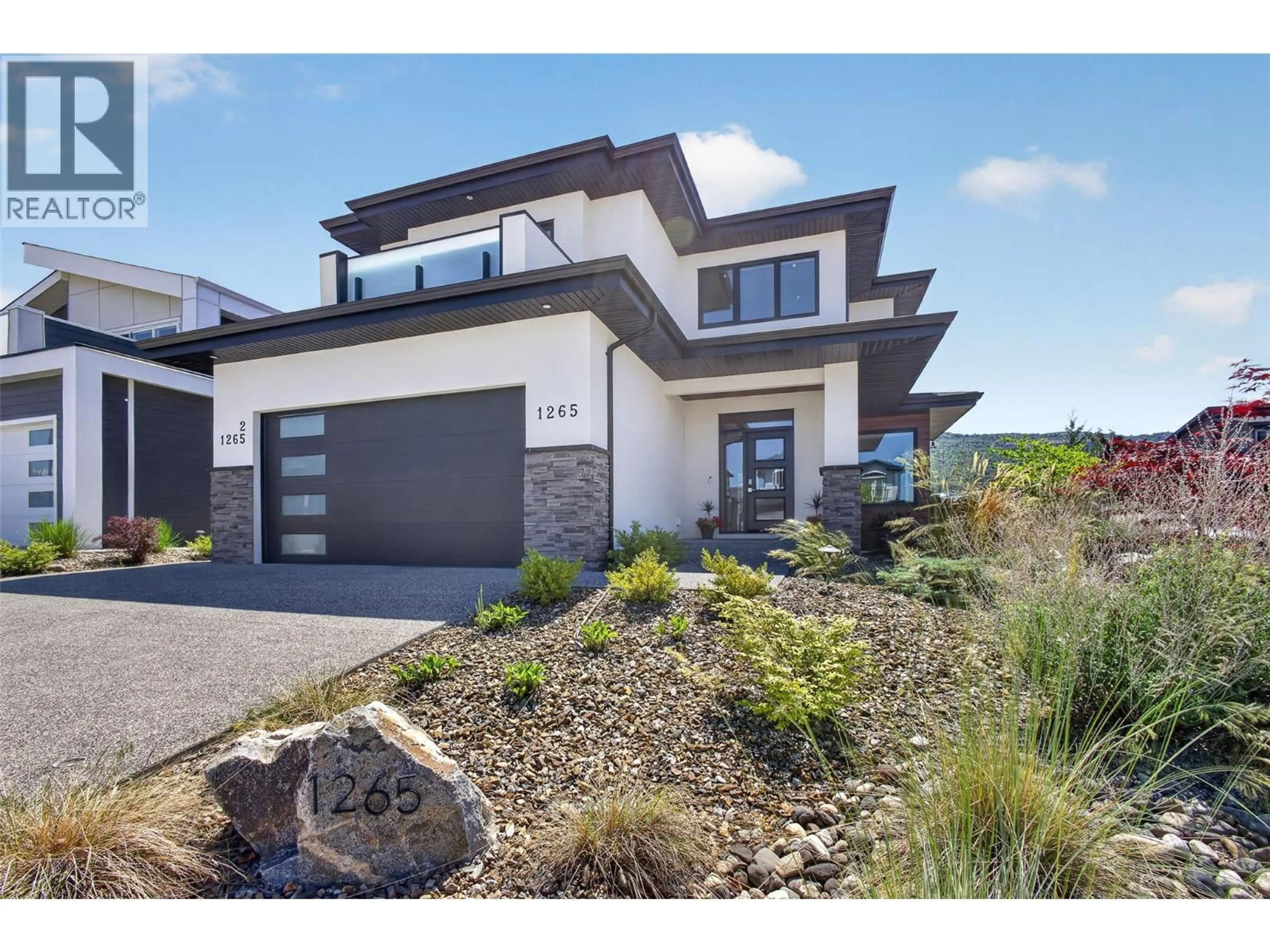 Home with brick exterior material, street for 1265 PONDS AVENUE, Kelowna British Columbia V1W5N1