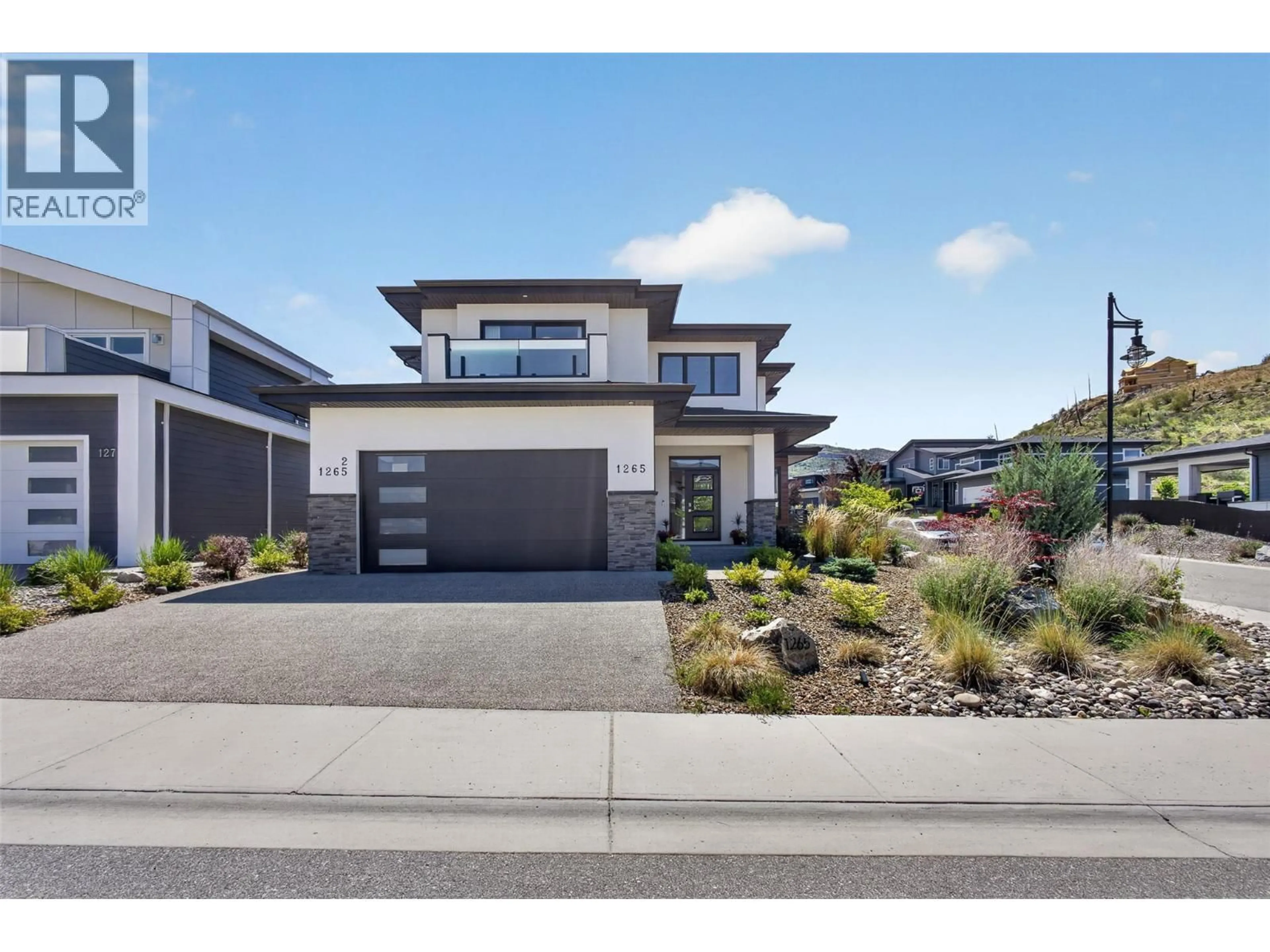 Home with brick exterior material, street for 1265 PONDS AVENUE, Kelowna British Columbia V1W5N1