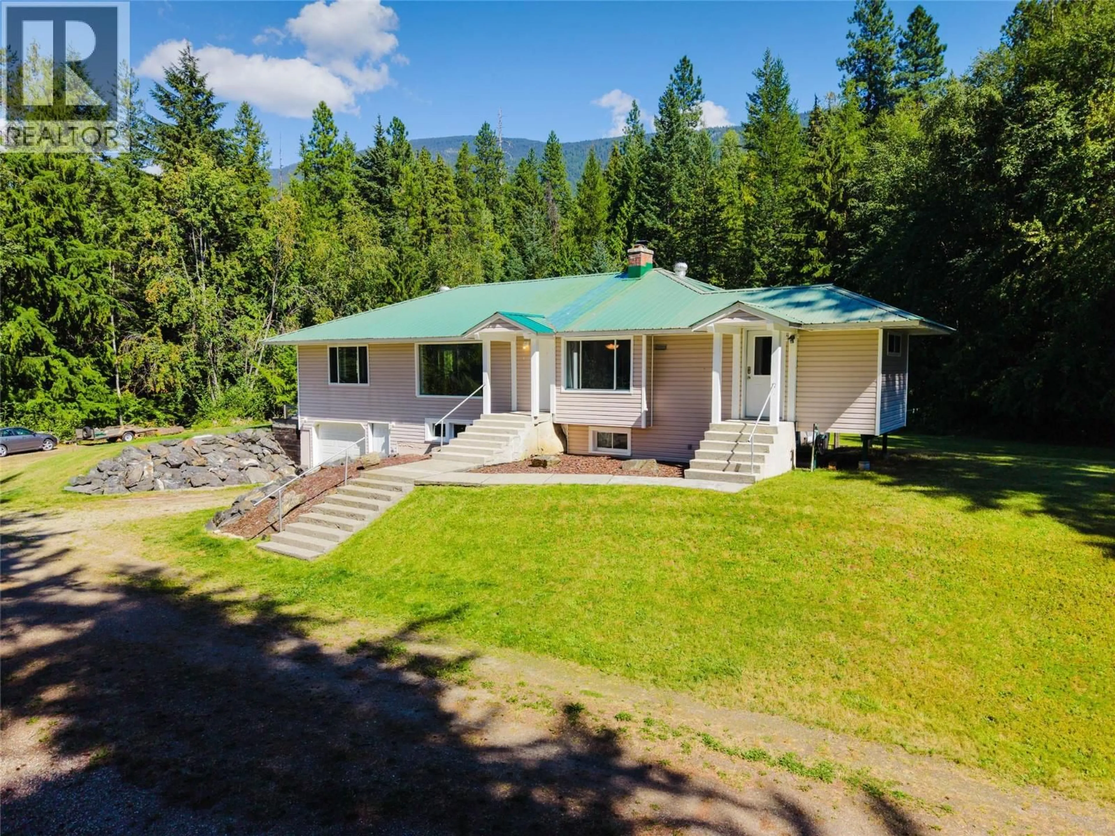 A pic from outside/outdoor area/front of a property/back of a property/a pic from drone, mountain view for 852 RIONDEL ROAD, Riondel British Columbia V0B1X0