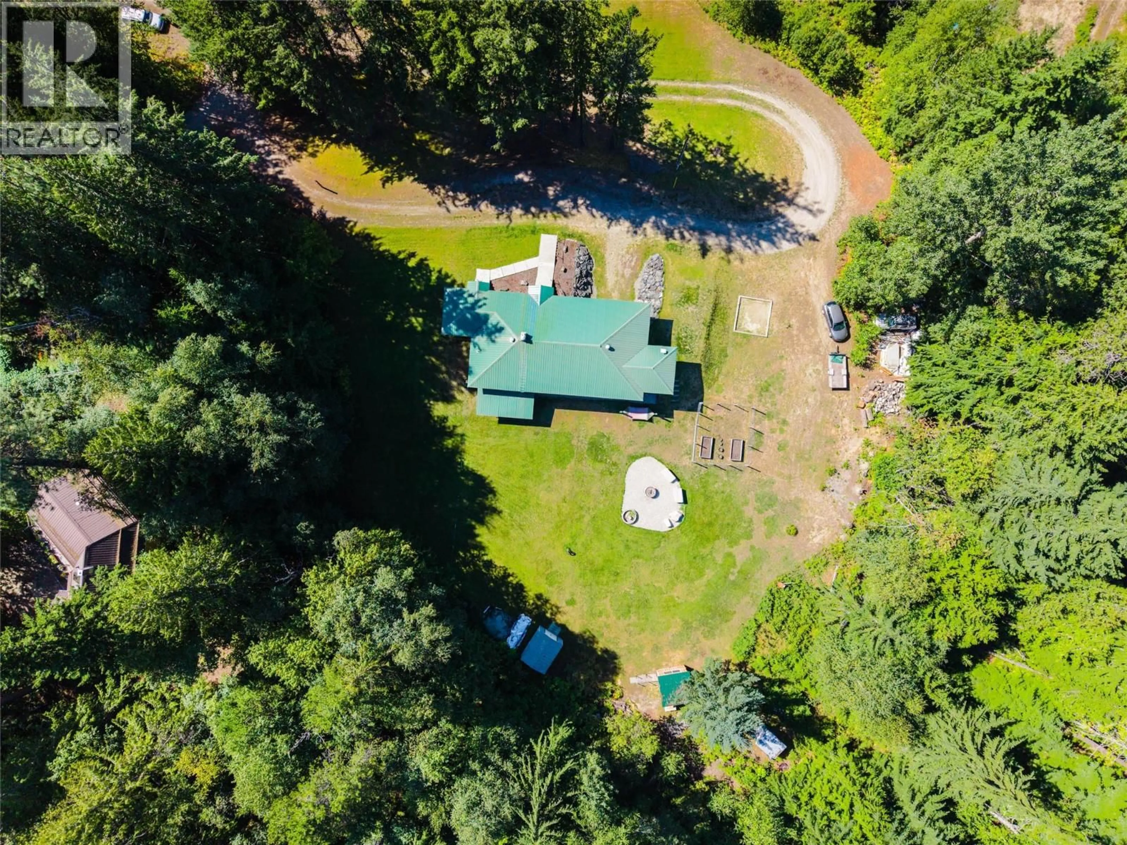 A pic from outside/outdoor area/front of a property/back of a property/a pic from drone, forest/trees view for 852 RIONDEL ROAD, Riondel British Columbia V0B1X0
