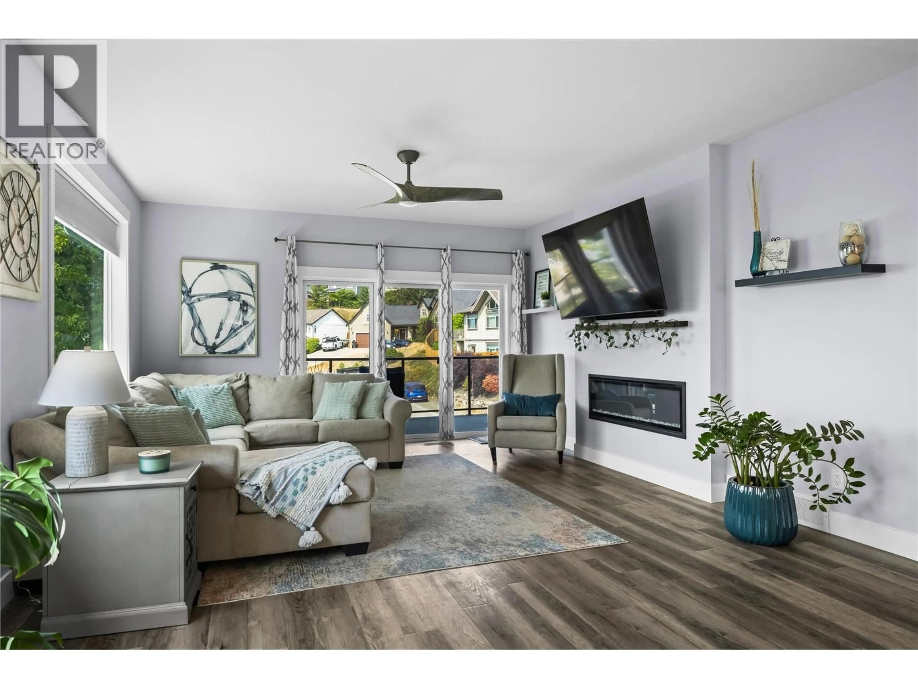 Living room with furniture, wood/laminate floor for 2180 SUNVIEW DRIVE, West Kelowna British Columbia V1Z3X9