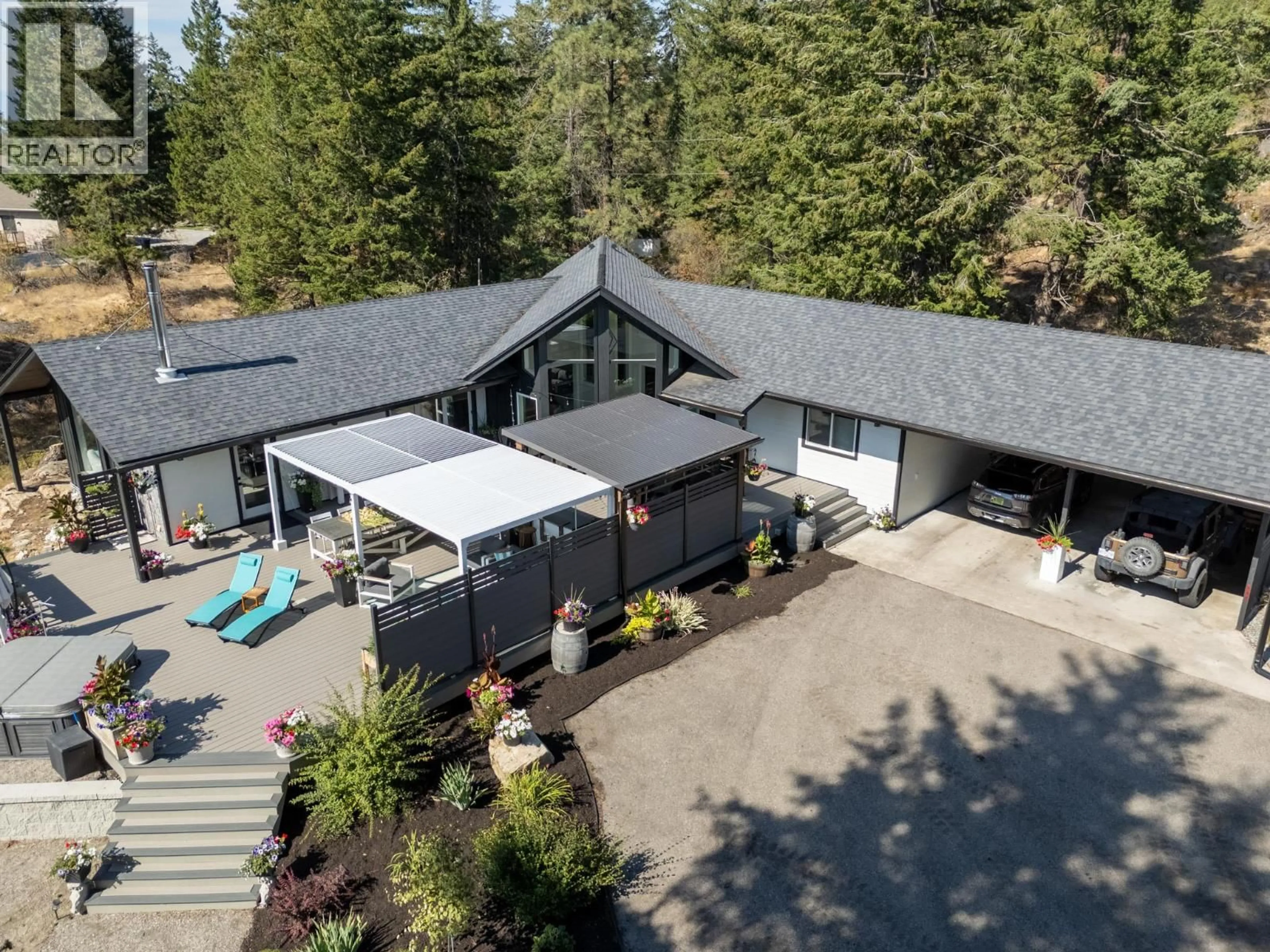 A pic from outside/outdoor area/front of a property/back of a property/a pic from drone, mountain view for 6474 SIERRA DRIVE, Kelowna British Columbia V1P1A4