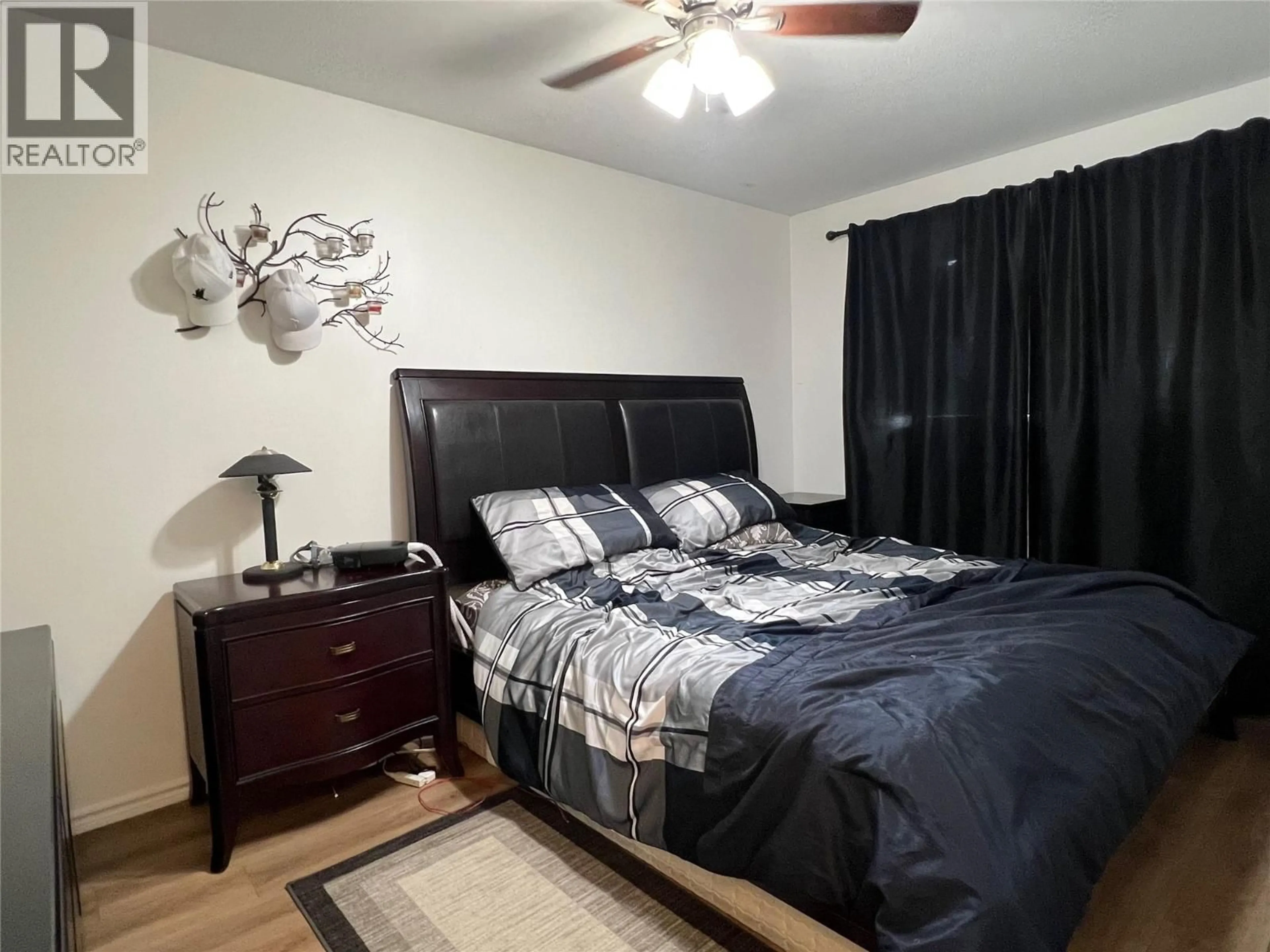 Bedroom with bed, wood/laminate floor for 3503 35 STREET, Vernon British Columbia V1T6C2