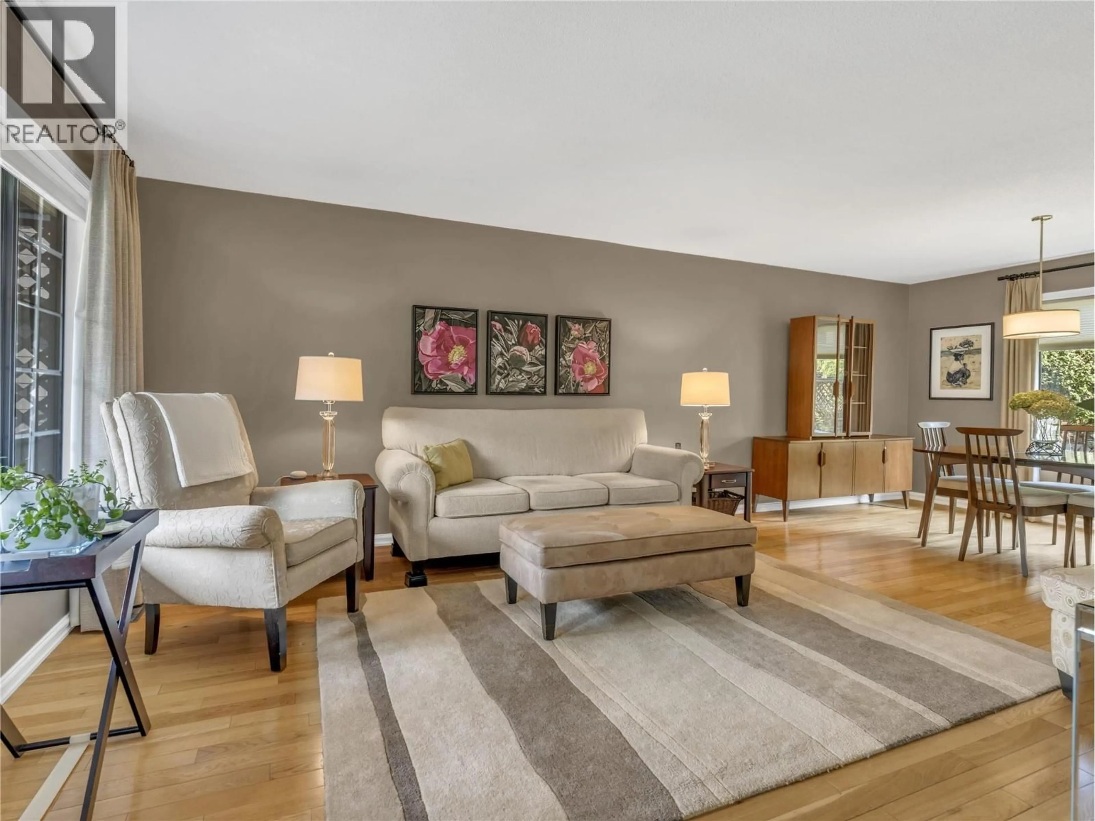 Living room with furniture, wood/laminate floor for 775 BALSAM AVENUE, Penticton British Columbia V2A7Y8