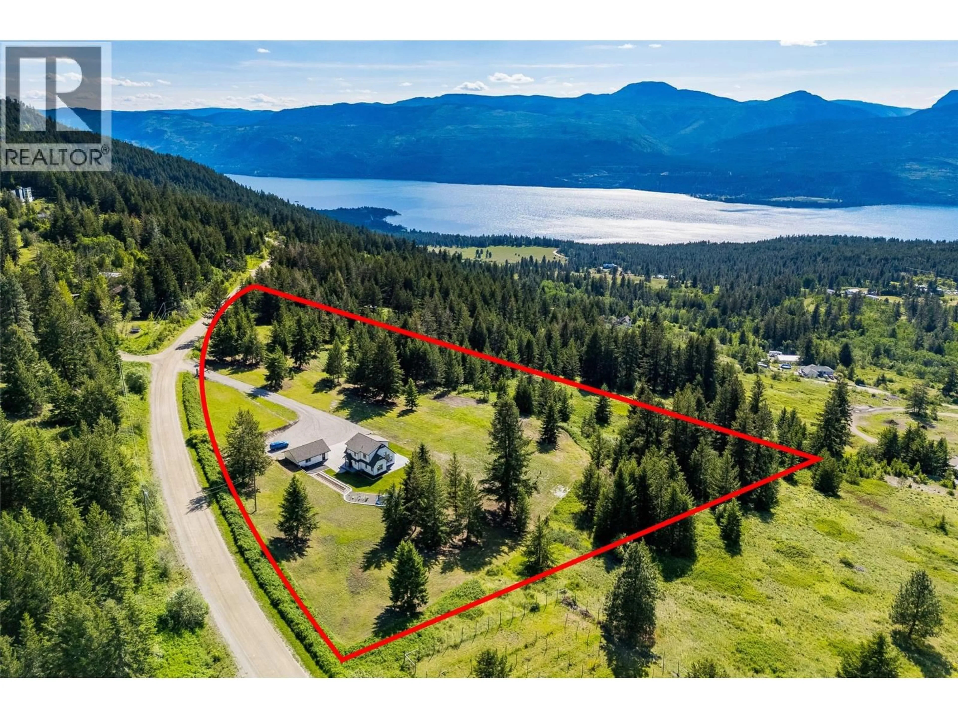 A pic from outside/outdoor area/front of a property/back of a property/a pic from drone, water/lake/river/ocean view for 17936 ANGUS ROAD, Lake Country British Columbia V4V1B6