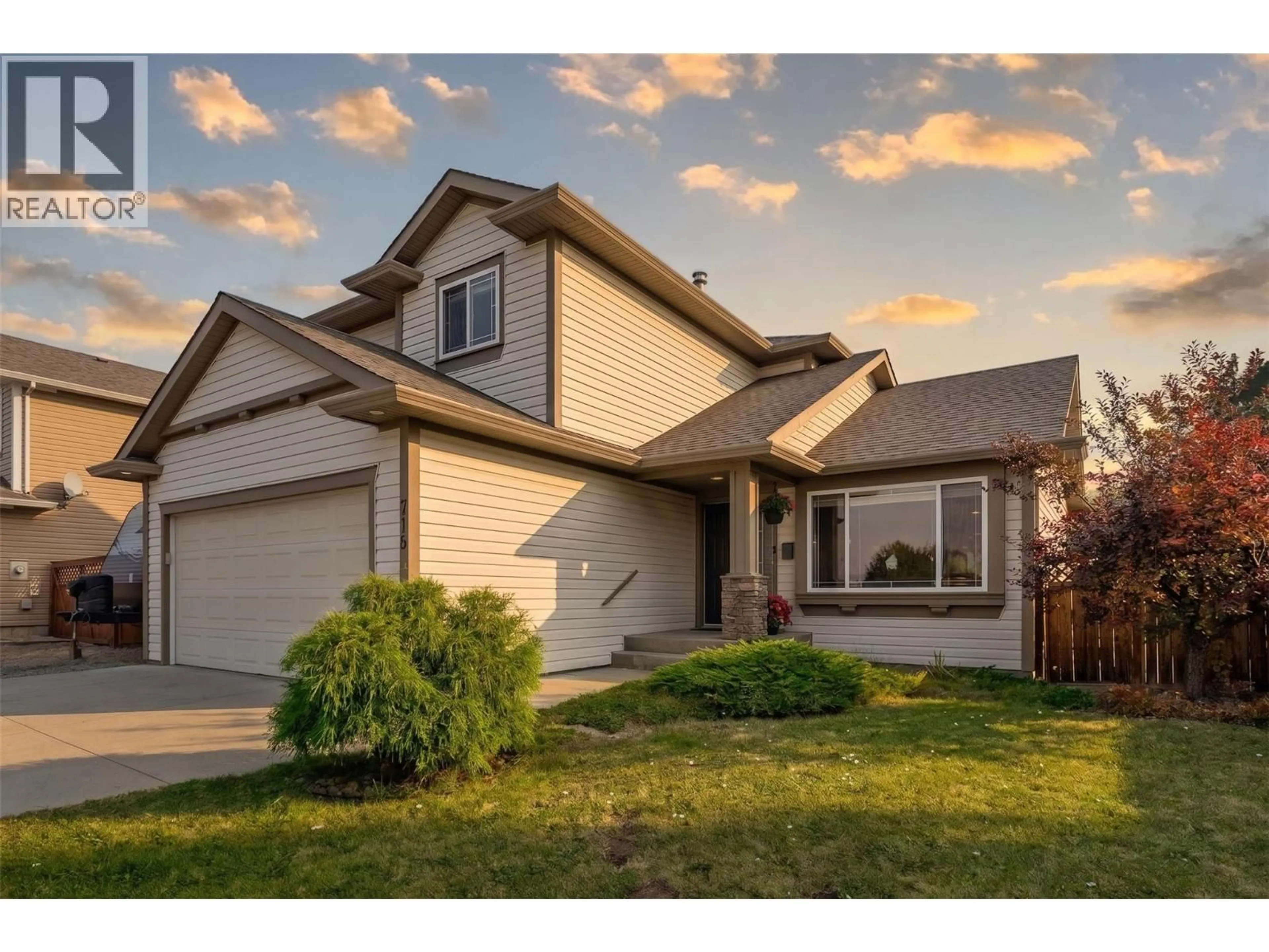 Home with vinyl exterior material, street for 715 HEMLOCK ROAD, Kelowna British Columbia V1X4W9