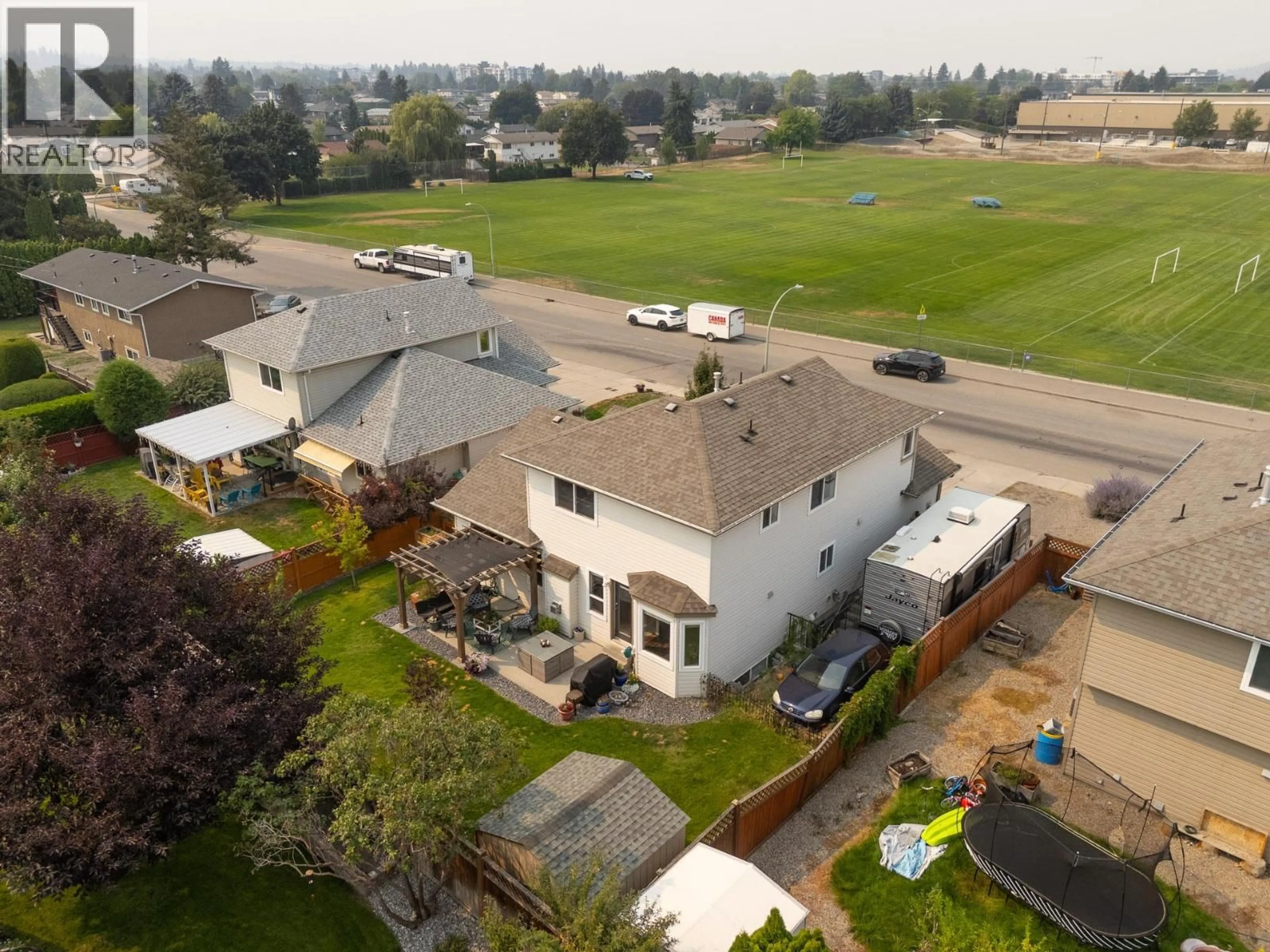 A pic from outside/outdoor area/front of a property/back of a property/a pic from drone, unknown for 715 HEMLOCK ROAD, Kelowna British Columbia V1X4W9