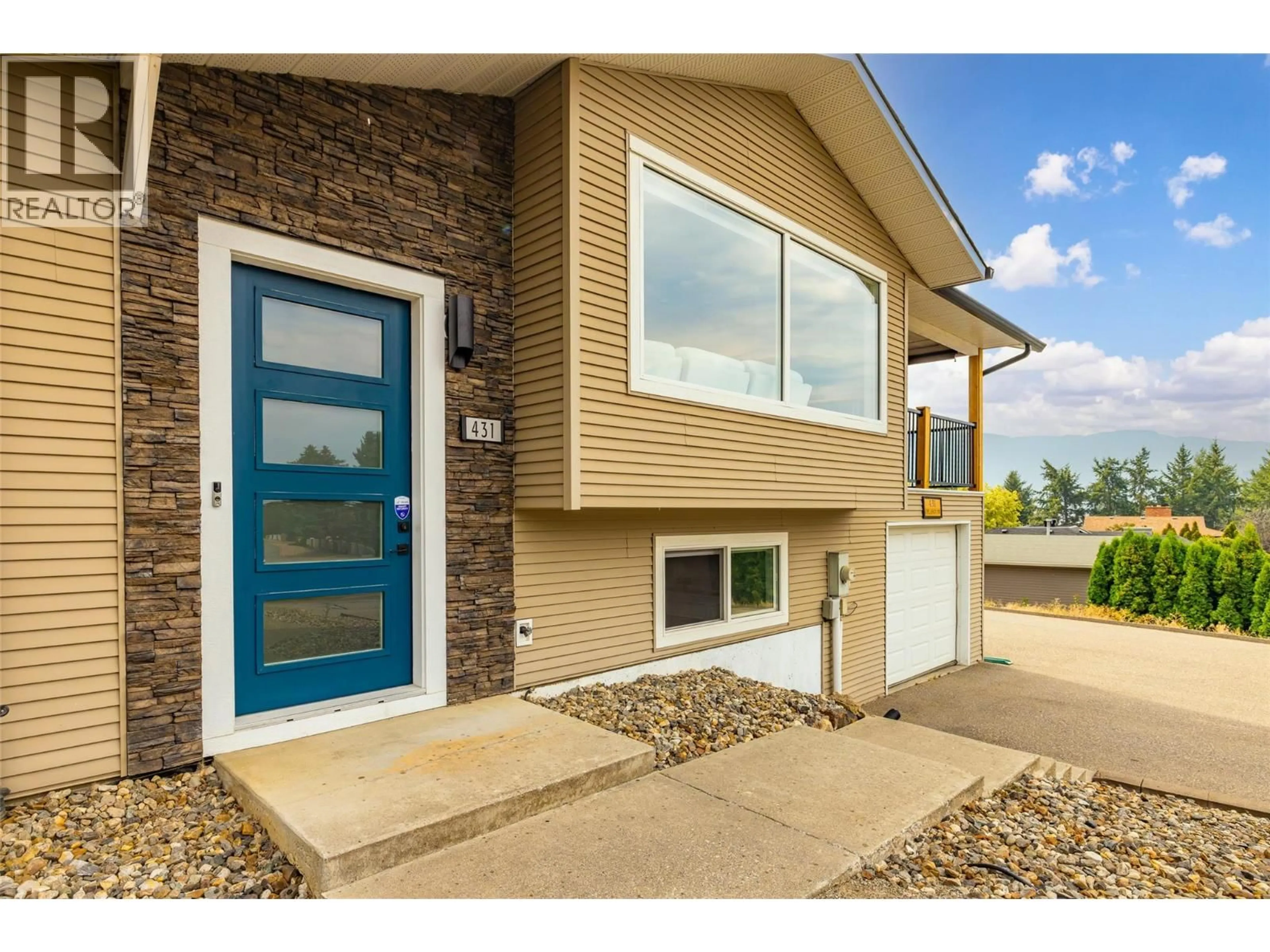 Home with vinyl exterior material, street for 431 UPLAND DRIVE, Coldstream British Columbia V1B2X7