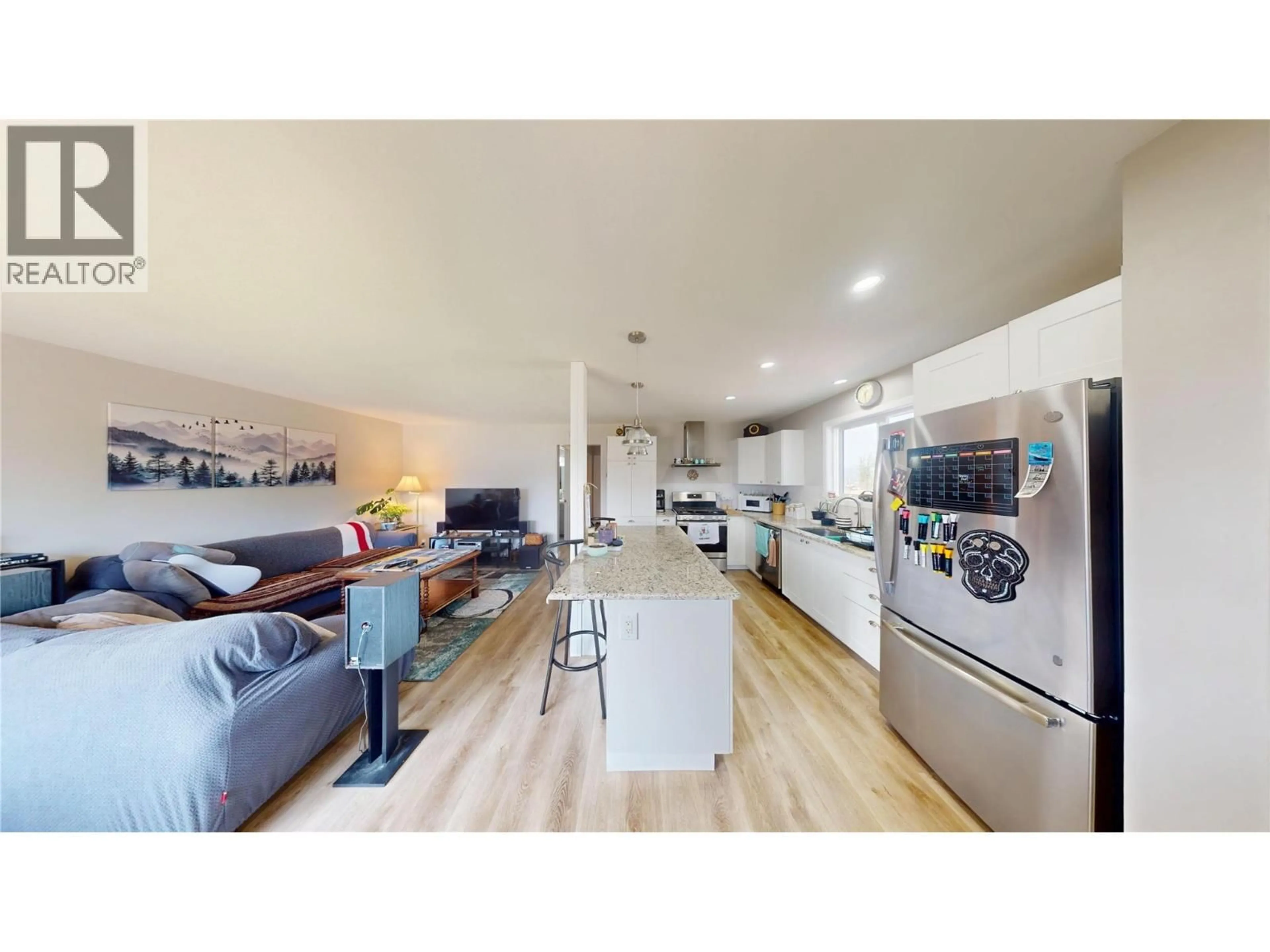 Open concept kitchen, wood/laminate floor for 227 19TH AVENUE SOUTH, Cranbrook British Columbia V1C3E1