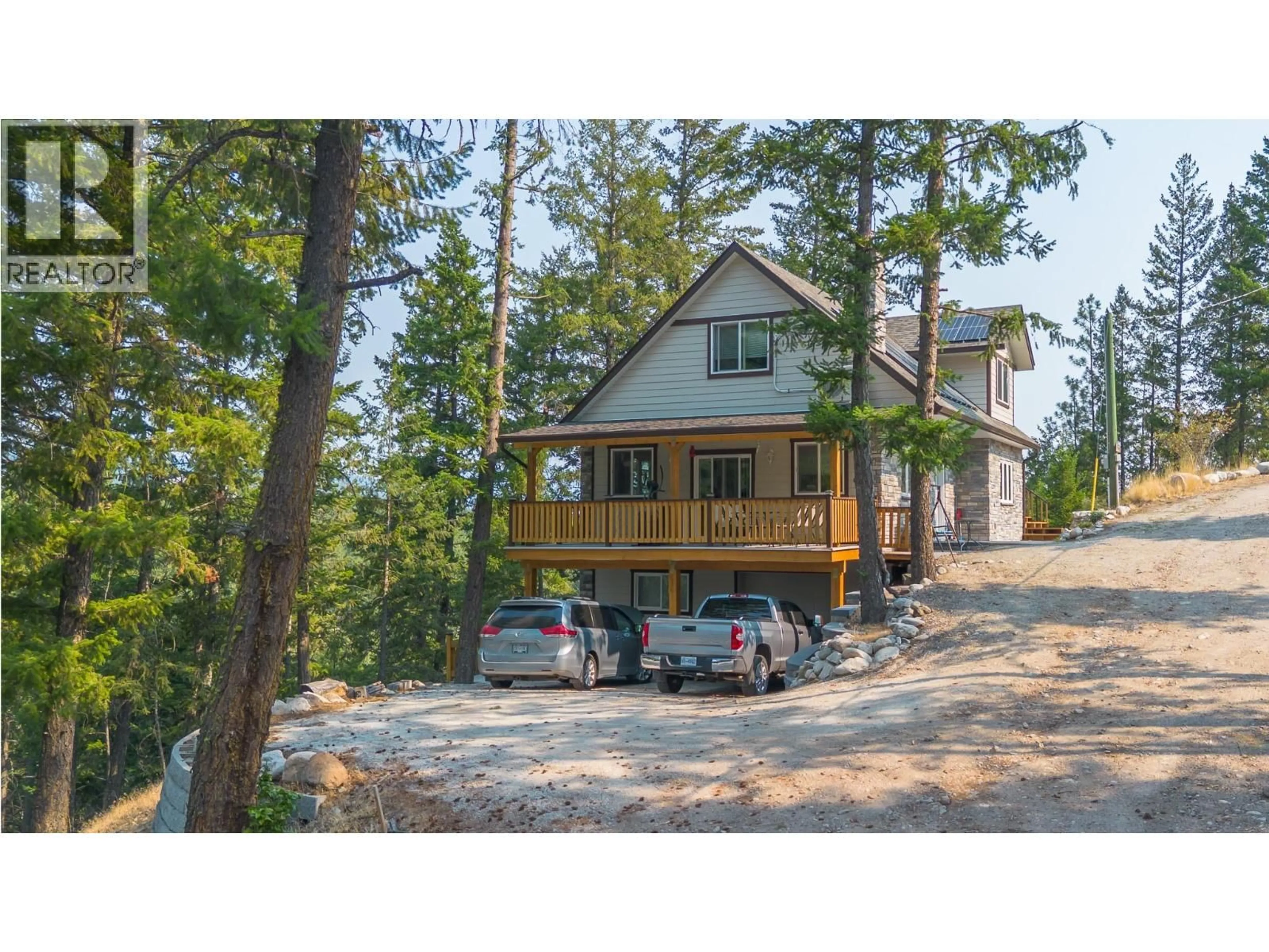 A pic from outside/outdoor area/front of a property/back of a property/a pic from drone, mountain view for 10818 WESTSHORE ROAD, Vernon British Columbia V1H2C3