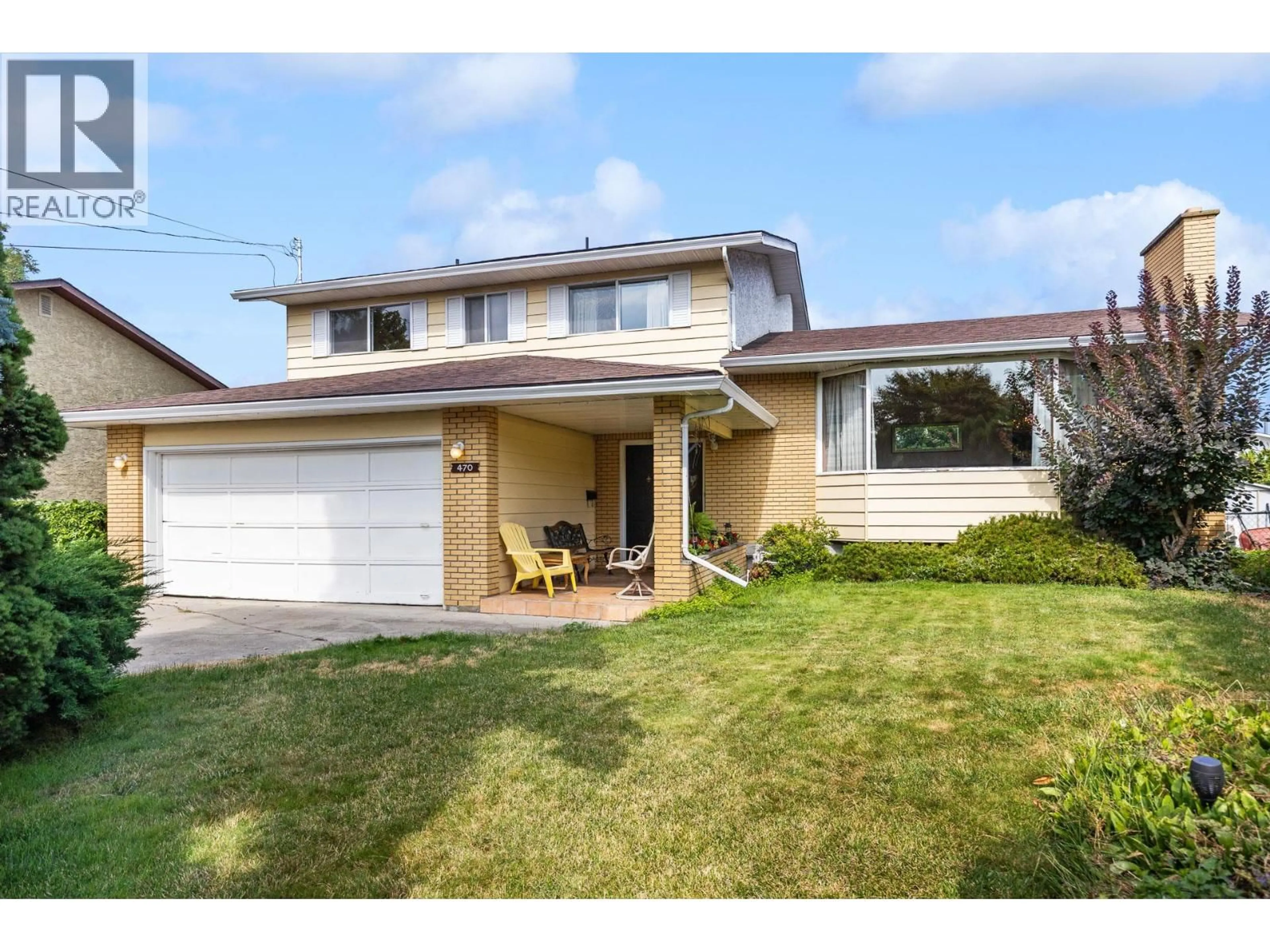Home with vinyl exterior material, street for 470 EUGENE ROAD, Kelowna British Columbia V1X2M4