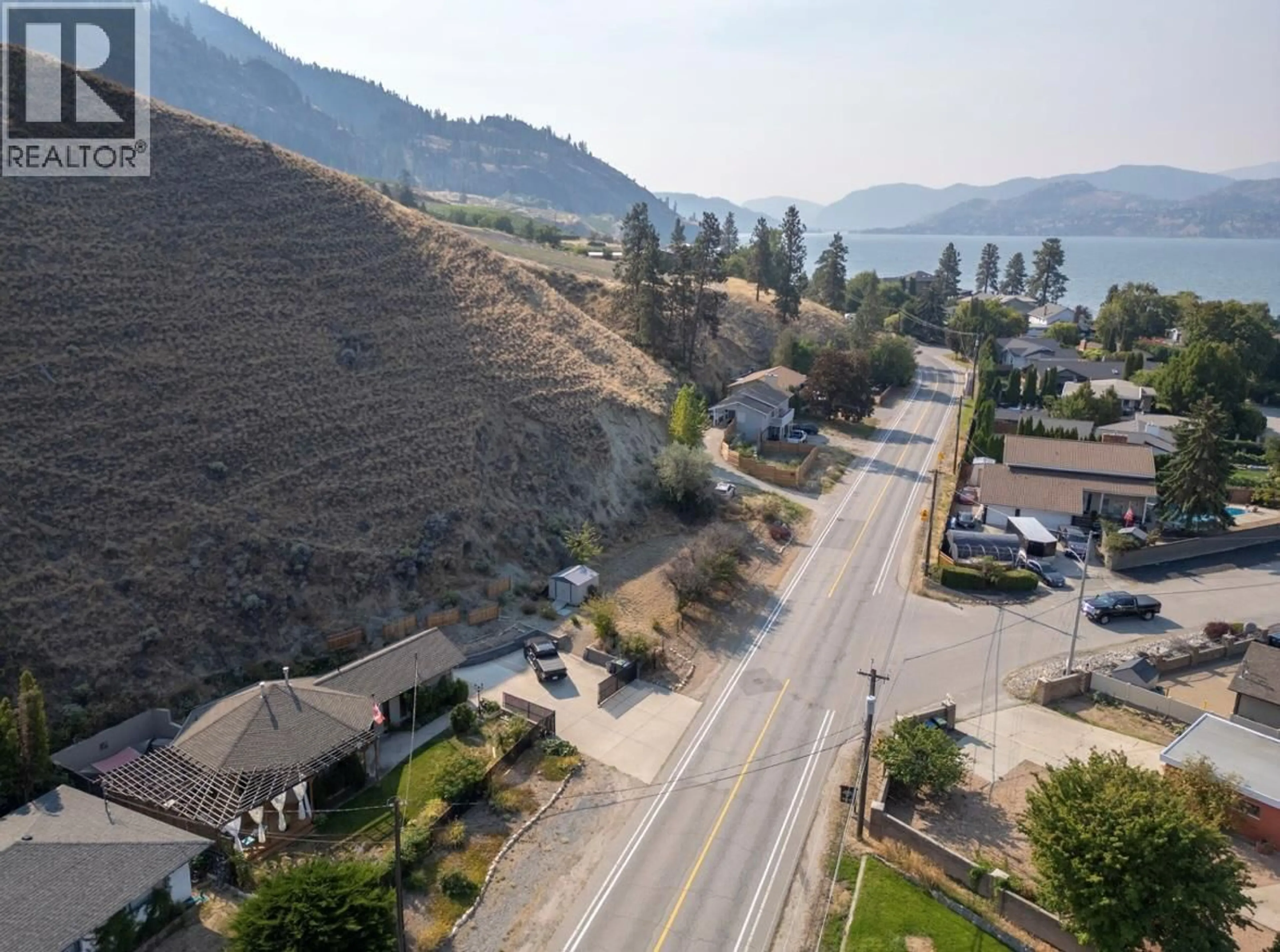 A pic from outside/outdoor area/front of a property/back of a property/a pic from drone, mountain view for 4744 LAKESIDE ROAD, Penticton British Columbia V2A8W6