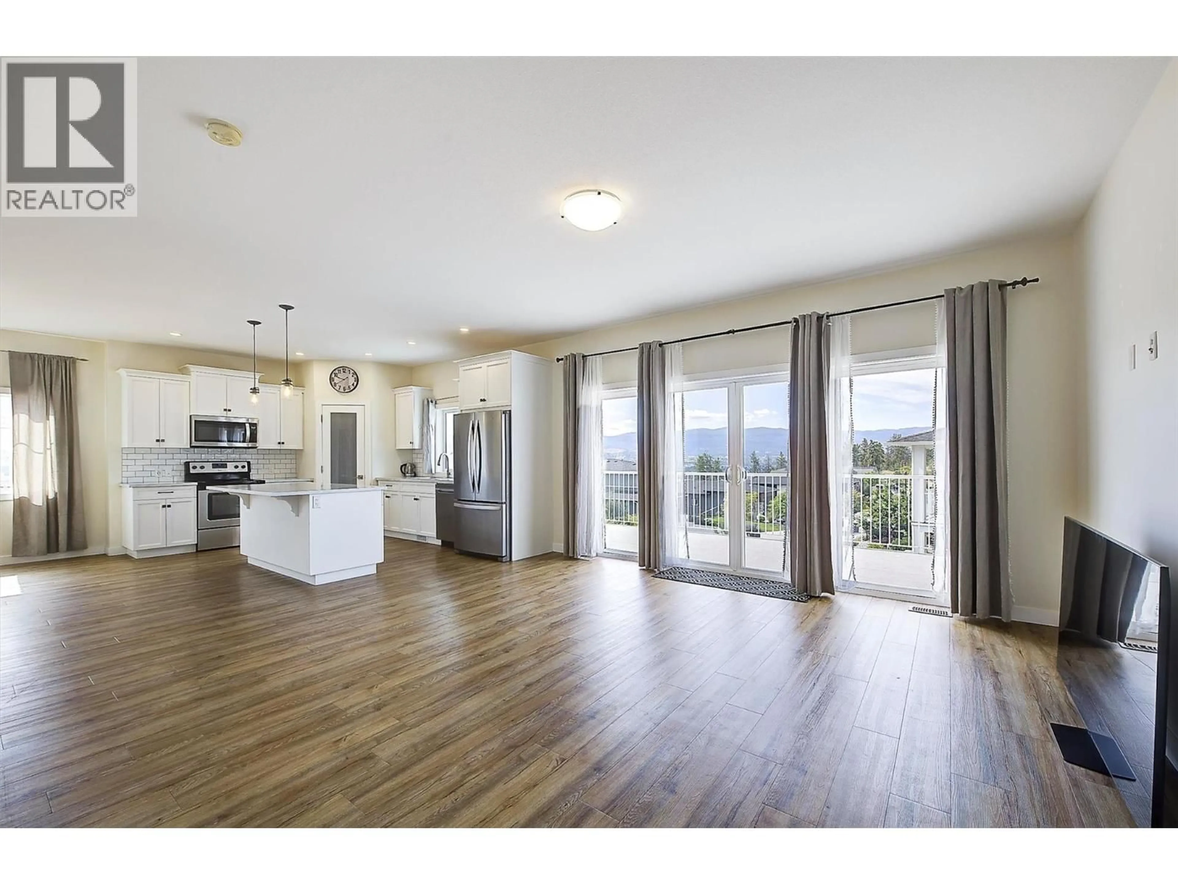 Open concept kitchen, wood/laminate floor for 741 YORKVILLE STREET, Kelowna British Columbia V1V0A9