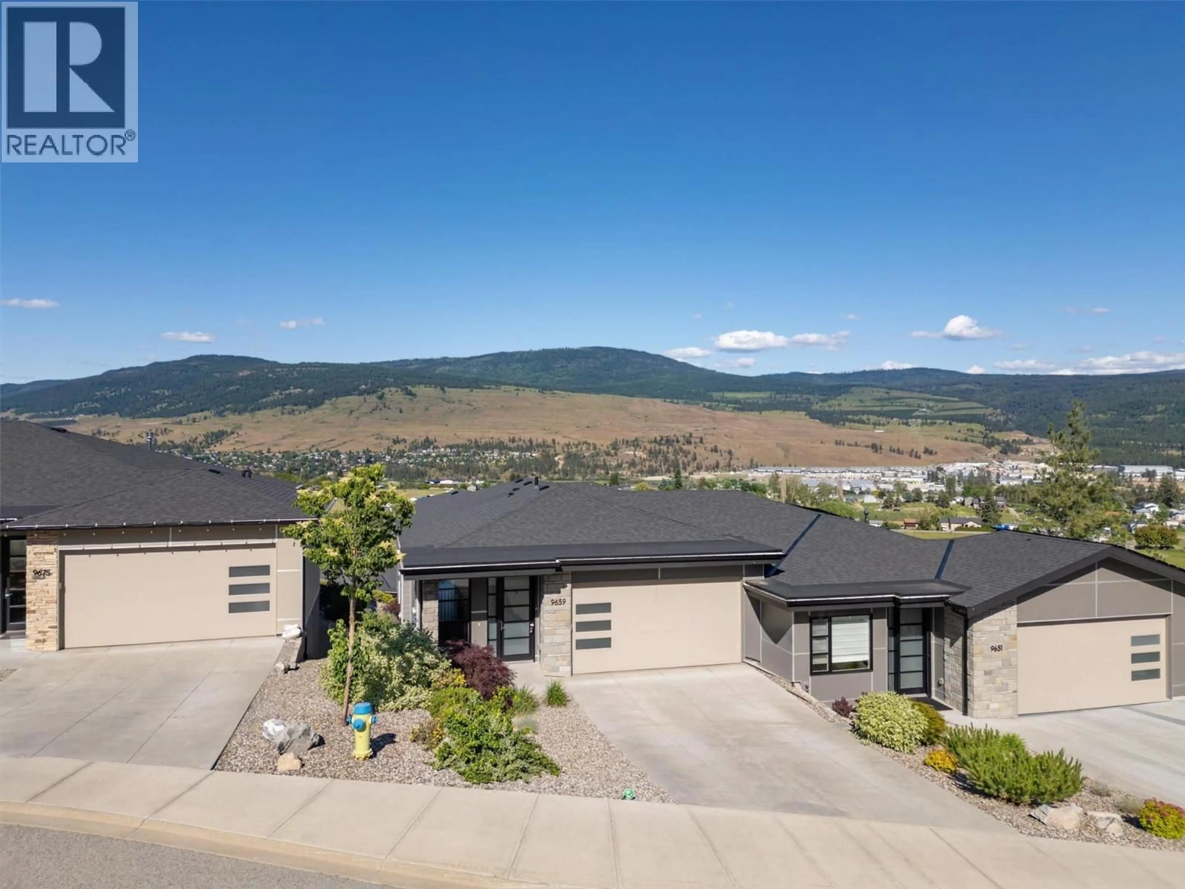 A pic from outside/outdoor area/front of a property/back of a property/a pic from drone, mountain view for 9659 SANTINA ROAD, Lake Country British Columbia V4V2R9