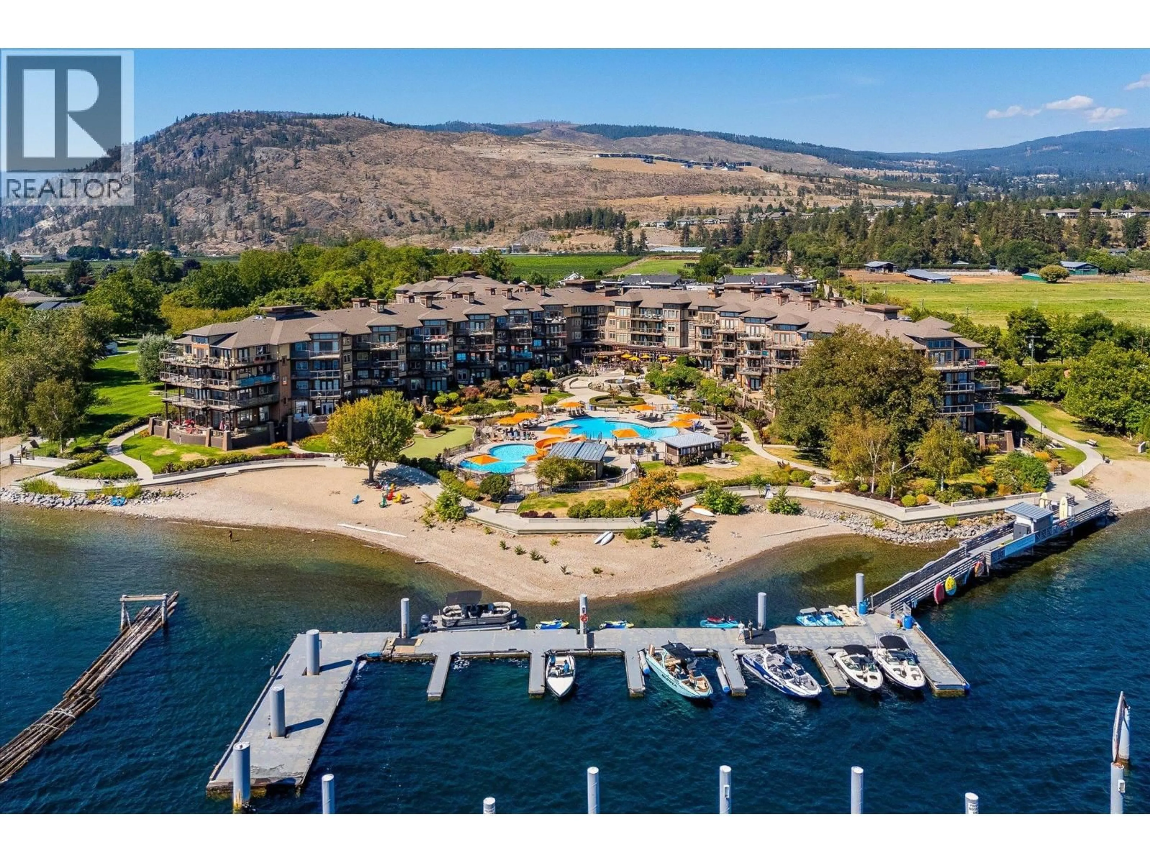 A pic from outside/outdoor area/front of a property/back of a property/a pic from drone, water/lake/river/ocean view for 407 - 4205 GELLATLY ROAD, West Kelowna British Columbia V4T2K2
