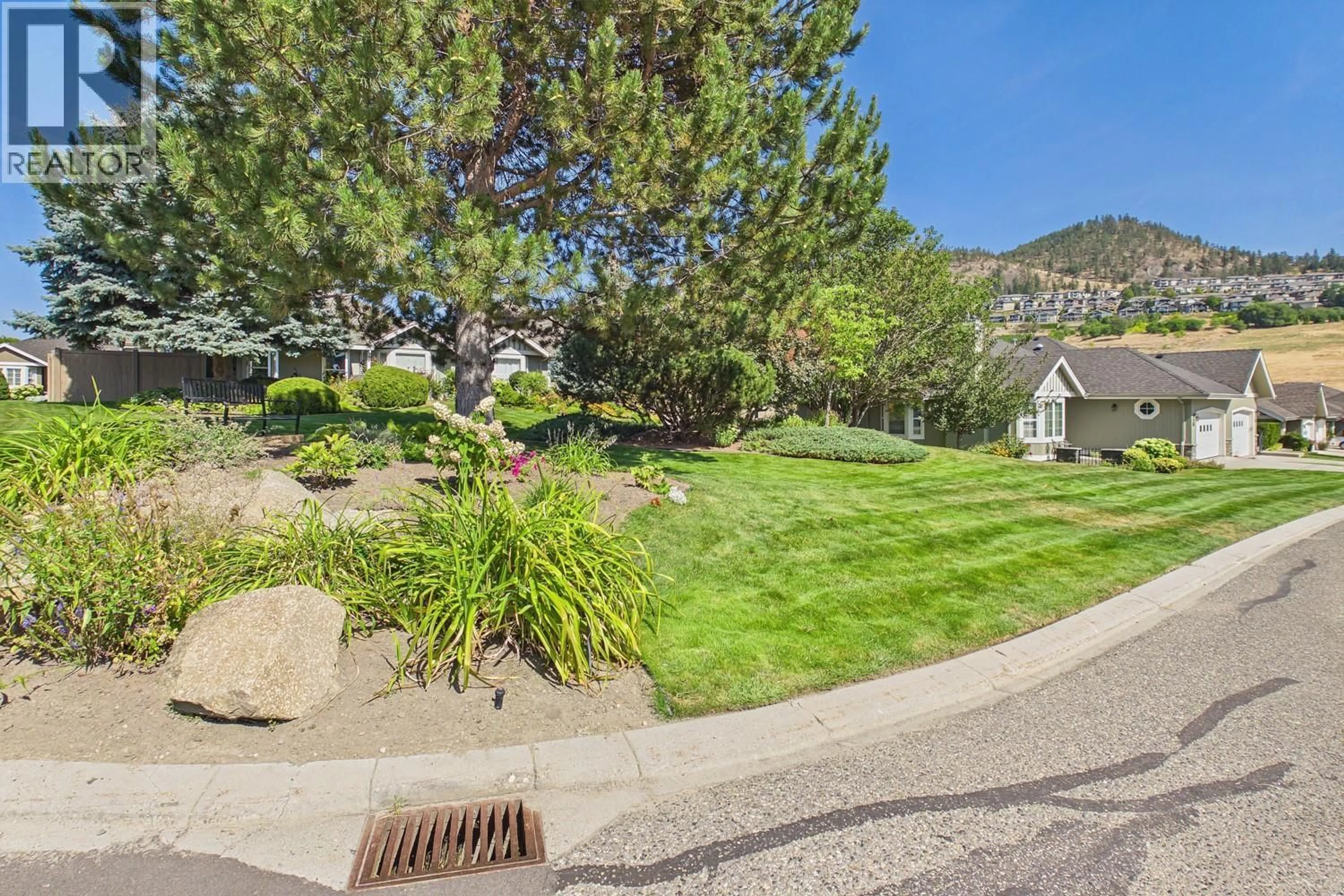 A pic from outside/outdoor area/front of a property/back of a property/a pic from drone, mountain view for 84 - 680 VALLEY ROAD, Kelowna British Columbia V1V2J3