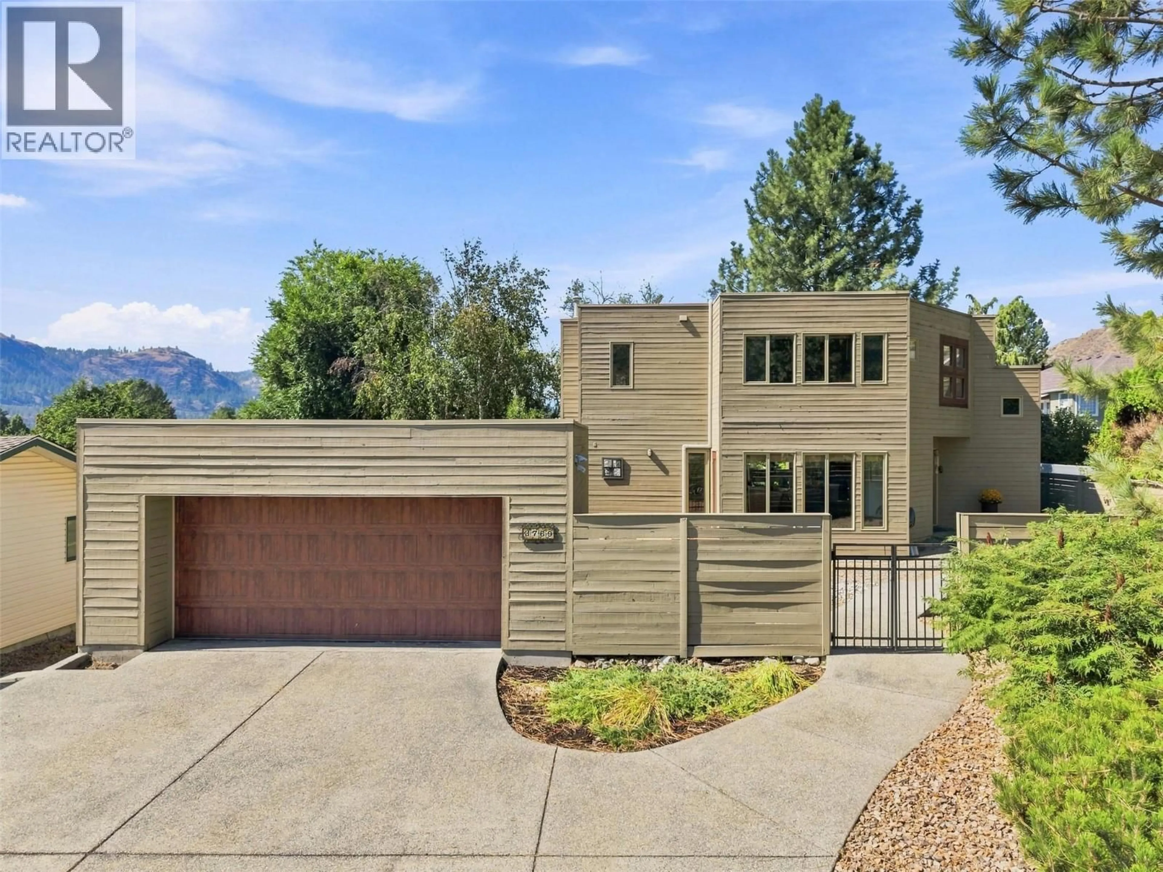 Home with brick exterior material, mountain view for 3769 NAVATANEE DRIVE, Kamloops British Columbia V2H1S1