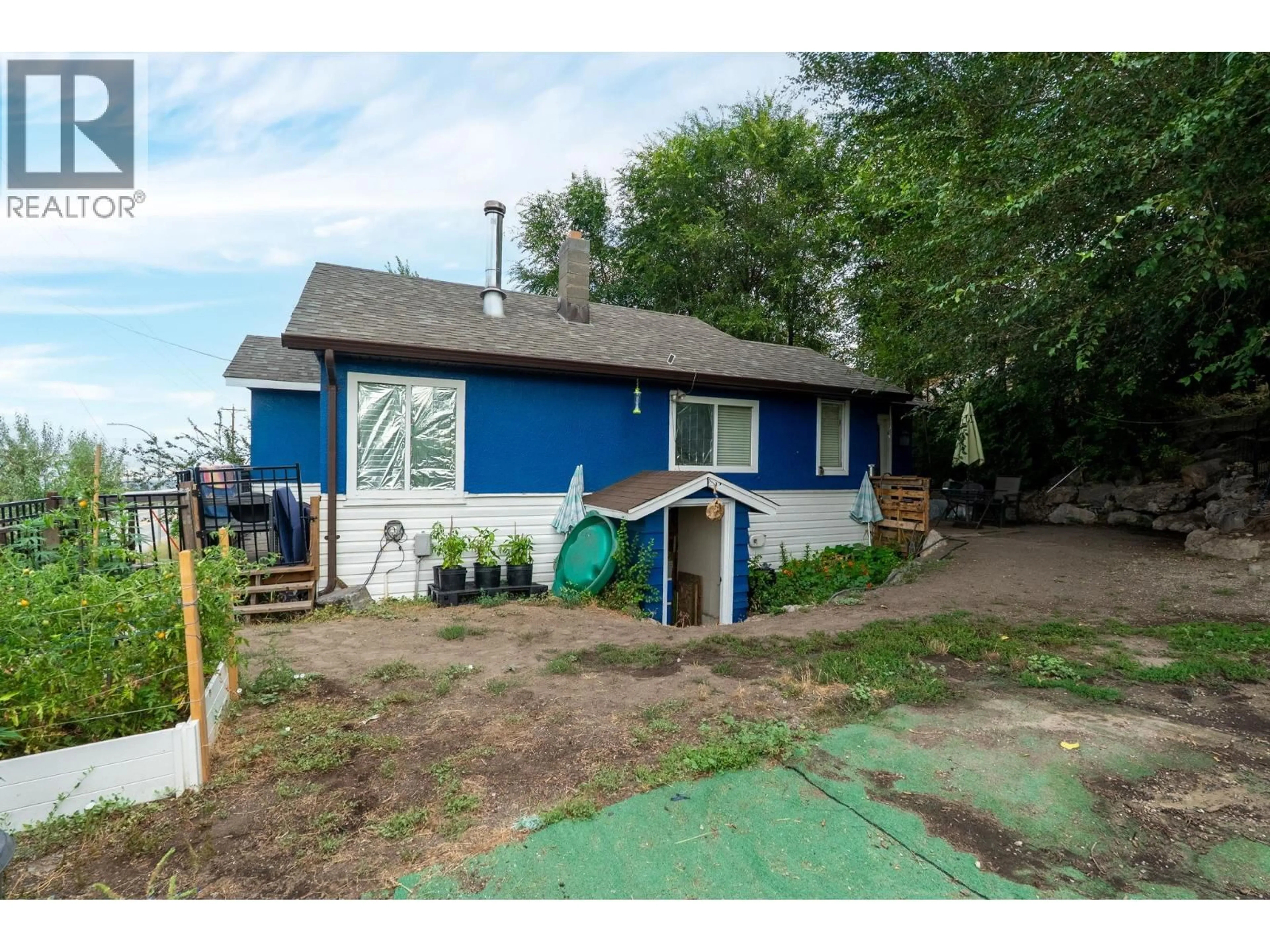 A pic from outside/outdoor area/front of a property/back of a property/a pic from drone, street for 1350 BENTIEN ROAD, Kelowna British Columbia V1X7K3