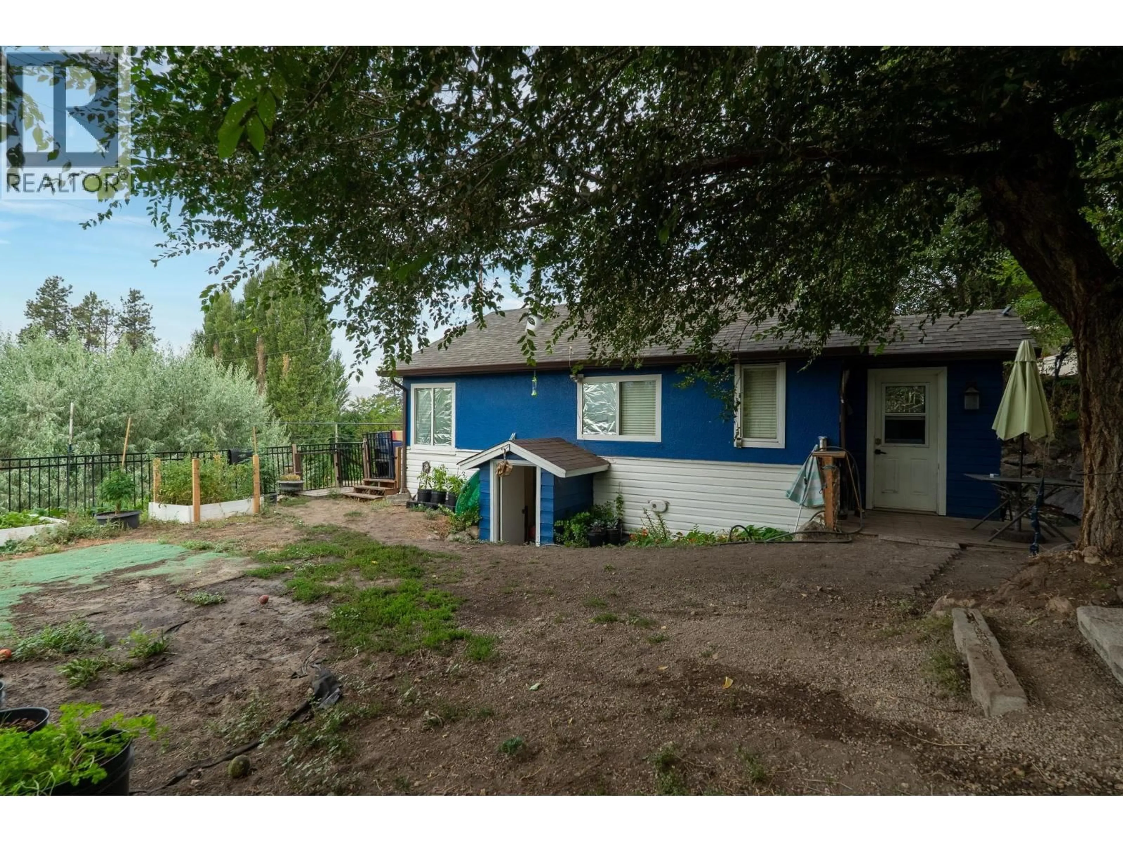 A pic from outside/outdoor area/front of a property/back of a property/a pic from drone, street for 1350 BENTIEN ROAD, Kelowna British Columbia V1X7K3