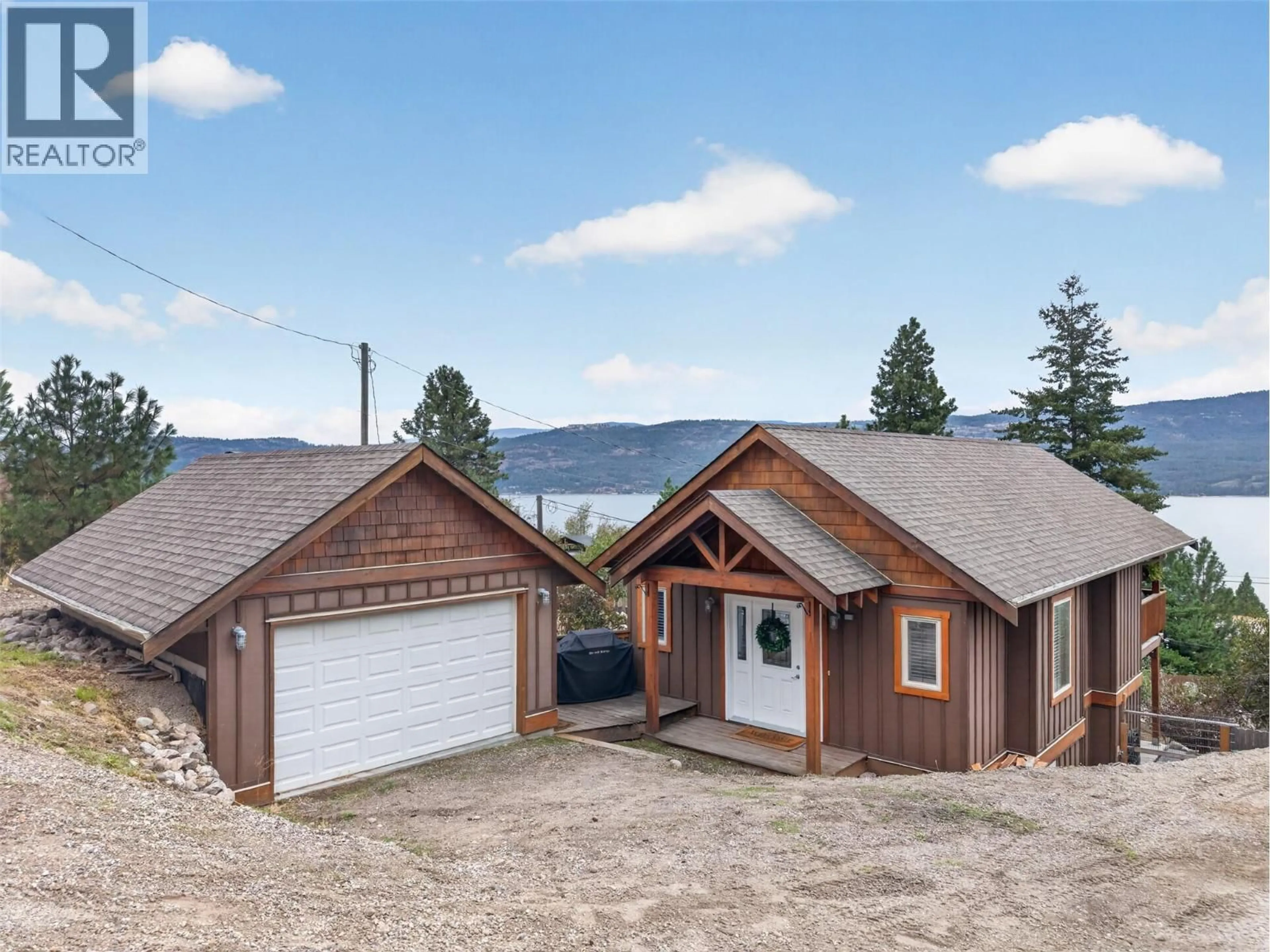A pic from outside/outdoor area/front of a property/back of a property/a pic from drone, mountain view for 10375 WESTSHORE ROAD, Vernon British Columbia V1H2B1
