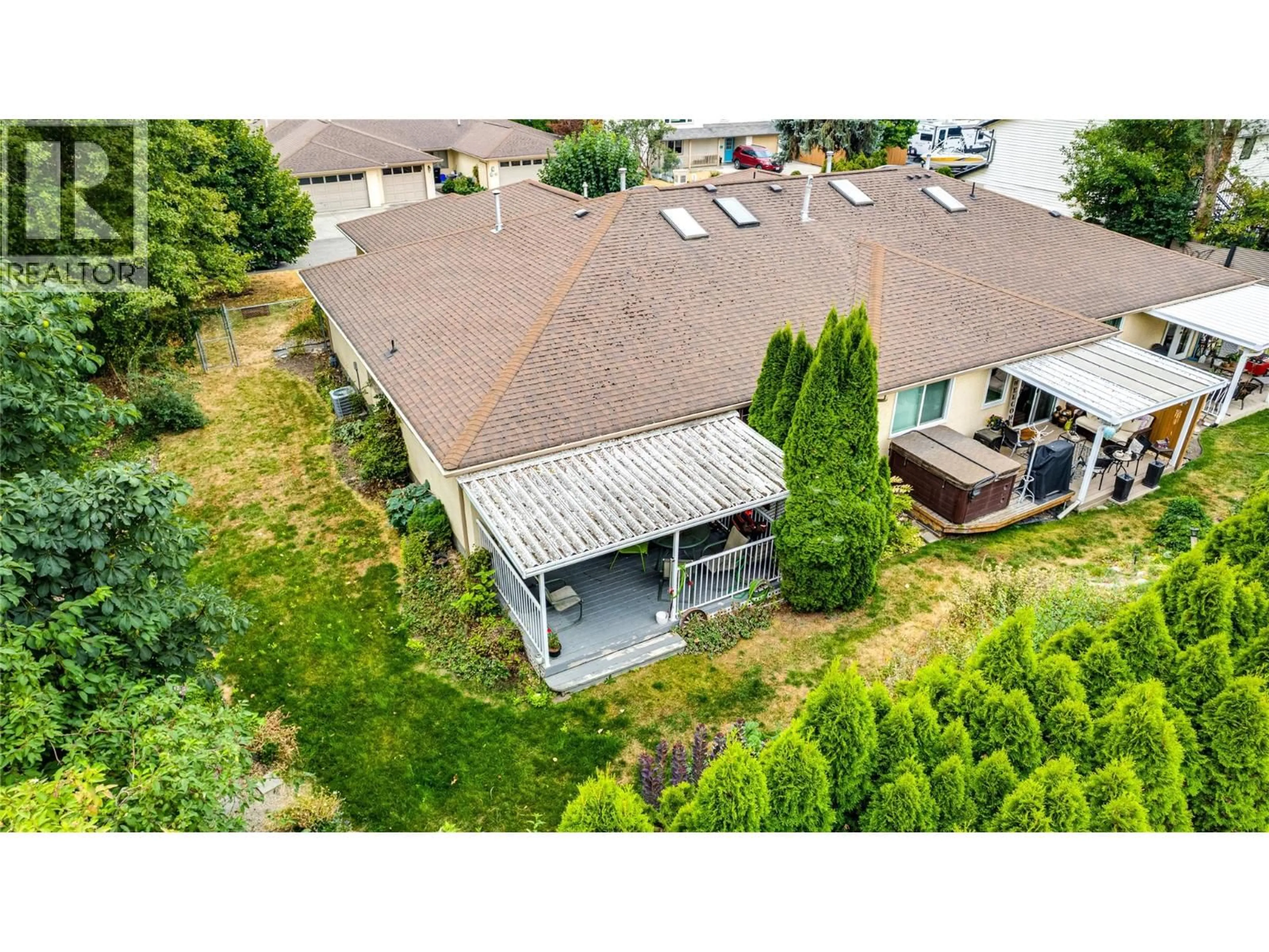 A pic from outside/outdoor area/front of a property/back of a property/a pic from drone, unknown for 5 - 1700 BIGHORN ROAD, Vernon British Columbia V1T9E1