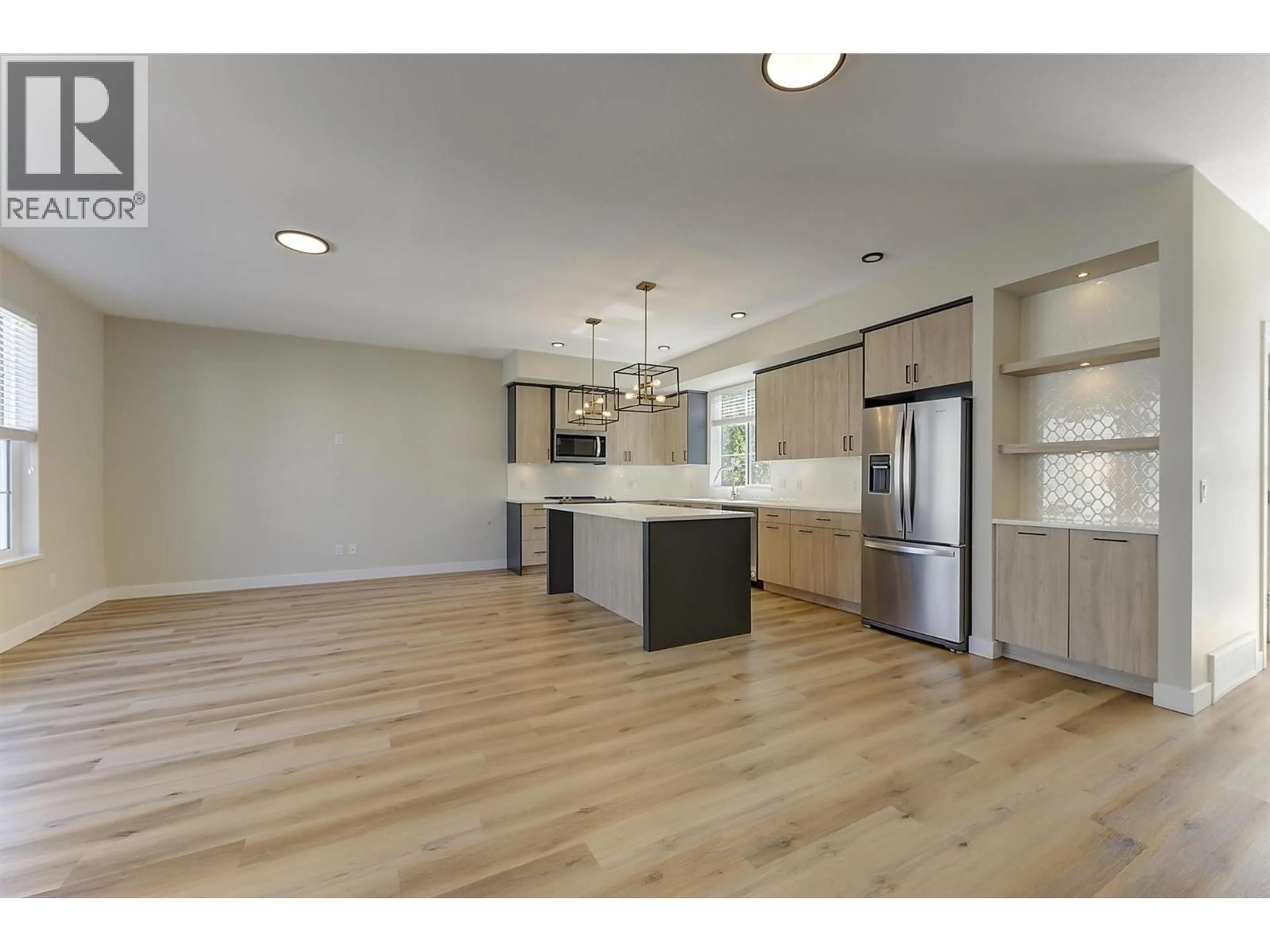 Open concept kitchen, wood/laminate floor for 126 - 4025 GELLATLY ROAD SOUTH, West Kelowna British Columbia V4T0E6