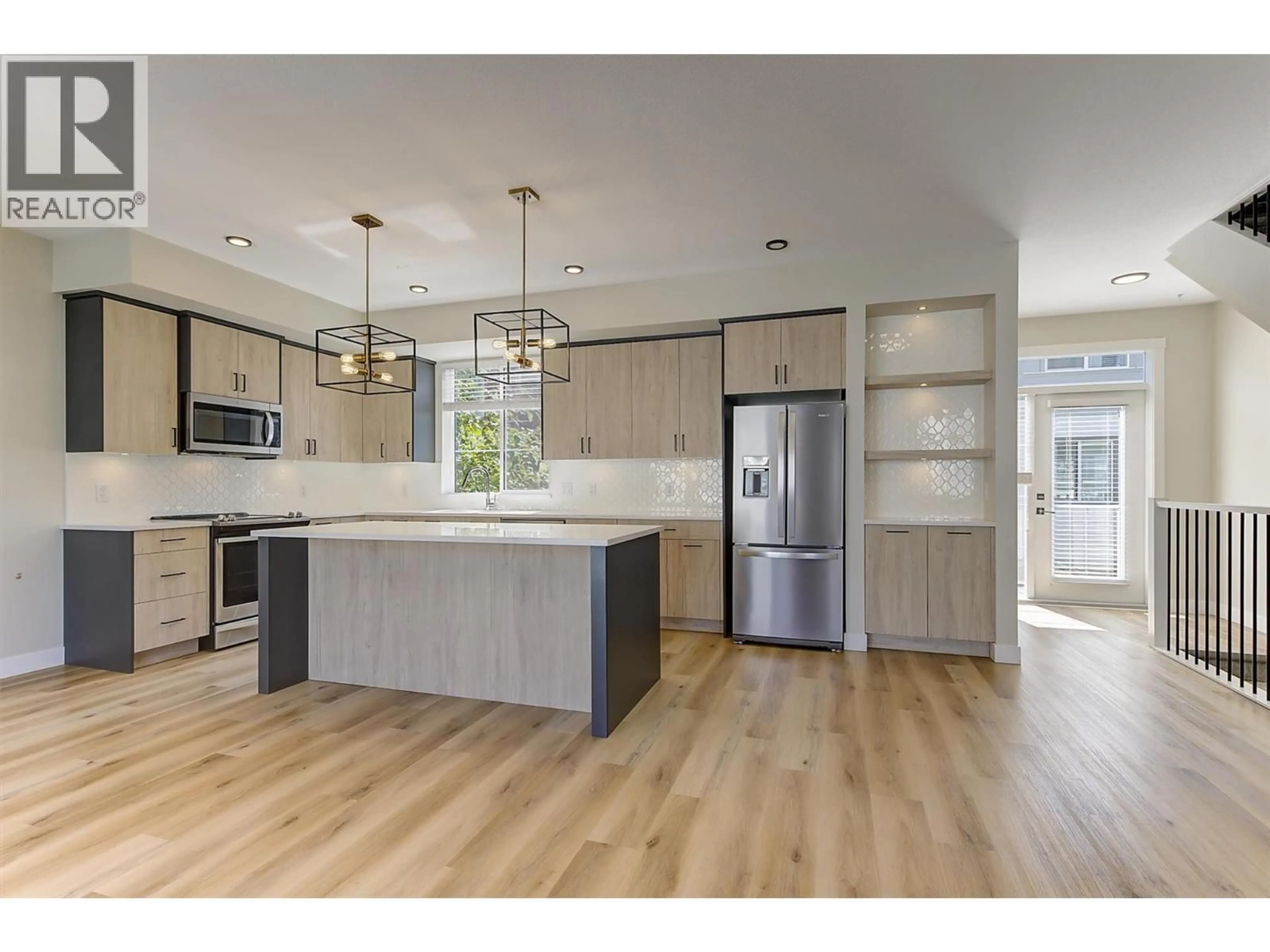 Open concept kitchen, wood/laminate floor for 126 - 4025 GELLATLY ROAD SOUTH, West Kelowna British Columbia V4T0E6
