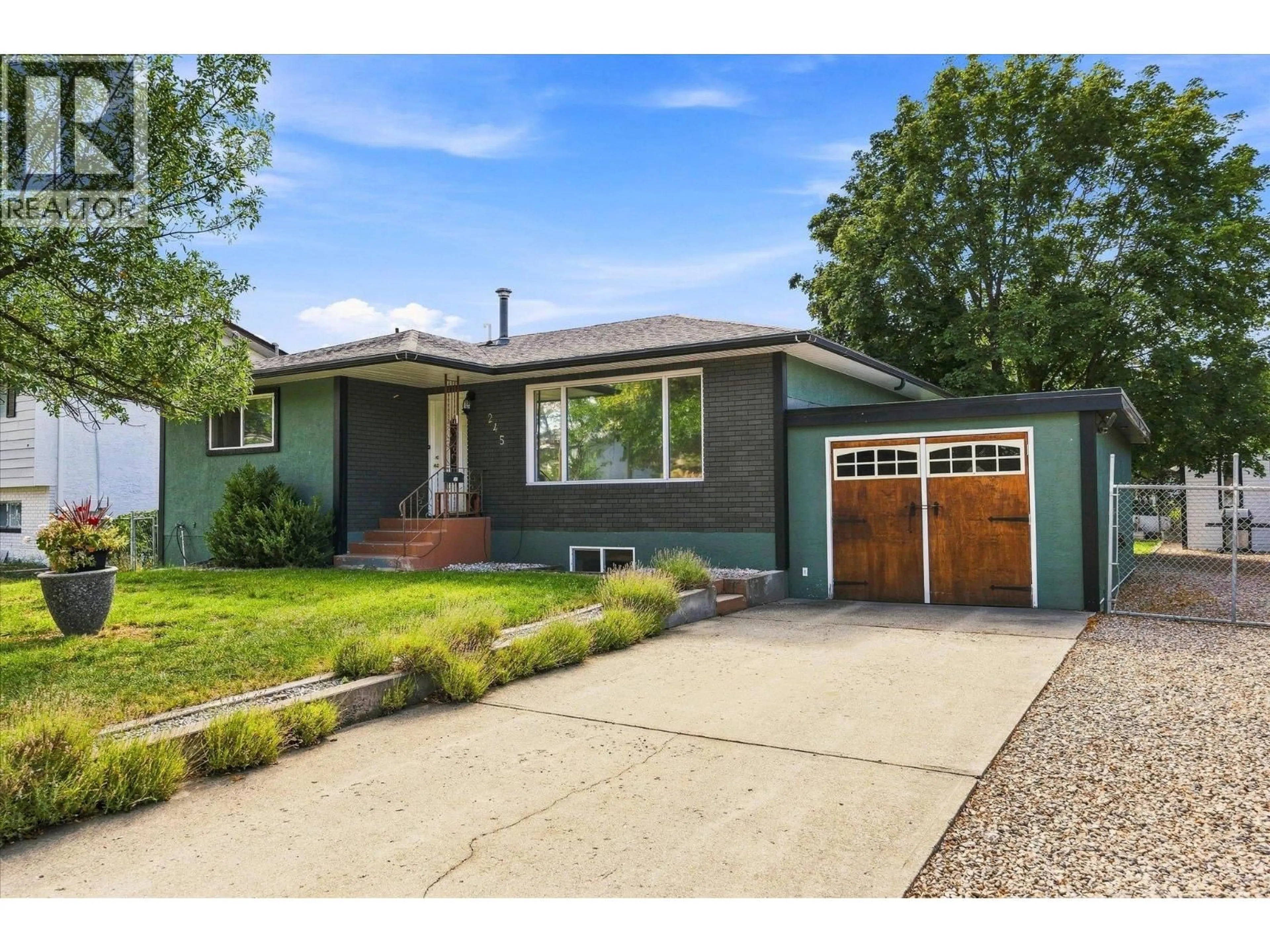 Home with vinyl exterior material, street for 245 HOLBROOK ROAD WEST, Kelowna British Columbia V1X1S1
