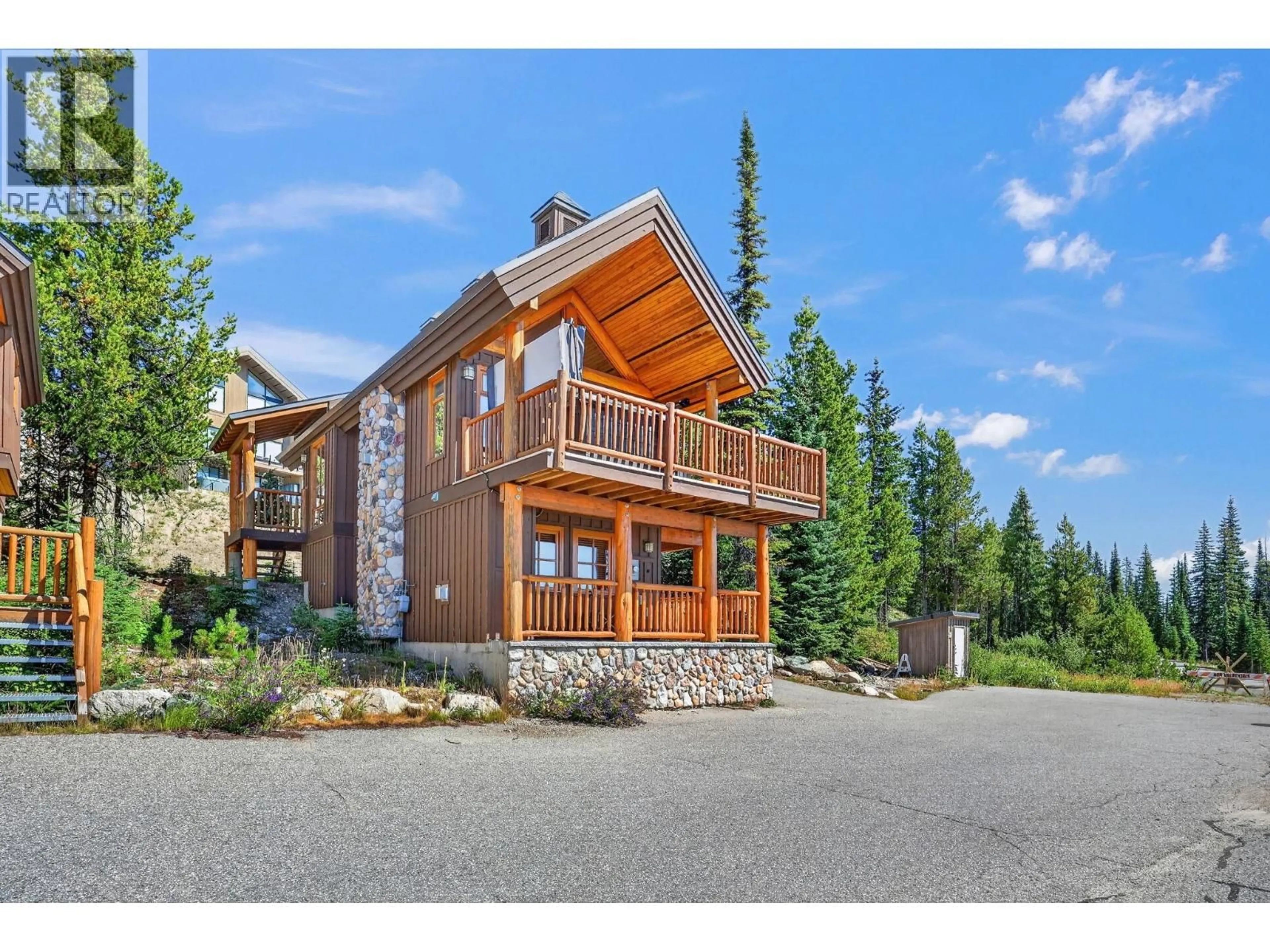 A pic from outside/outdoor area/front of a property/back of a property/a pic from drone, mountain view for 11 - 200 MOONSHINE CRESCENT, Big White British Columbia V1P1P3