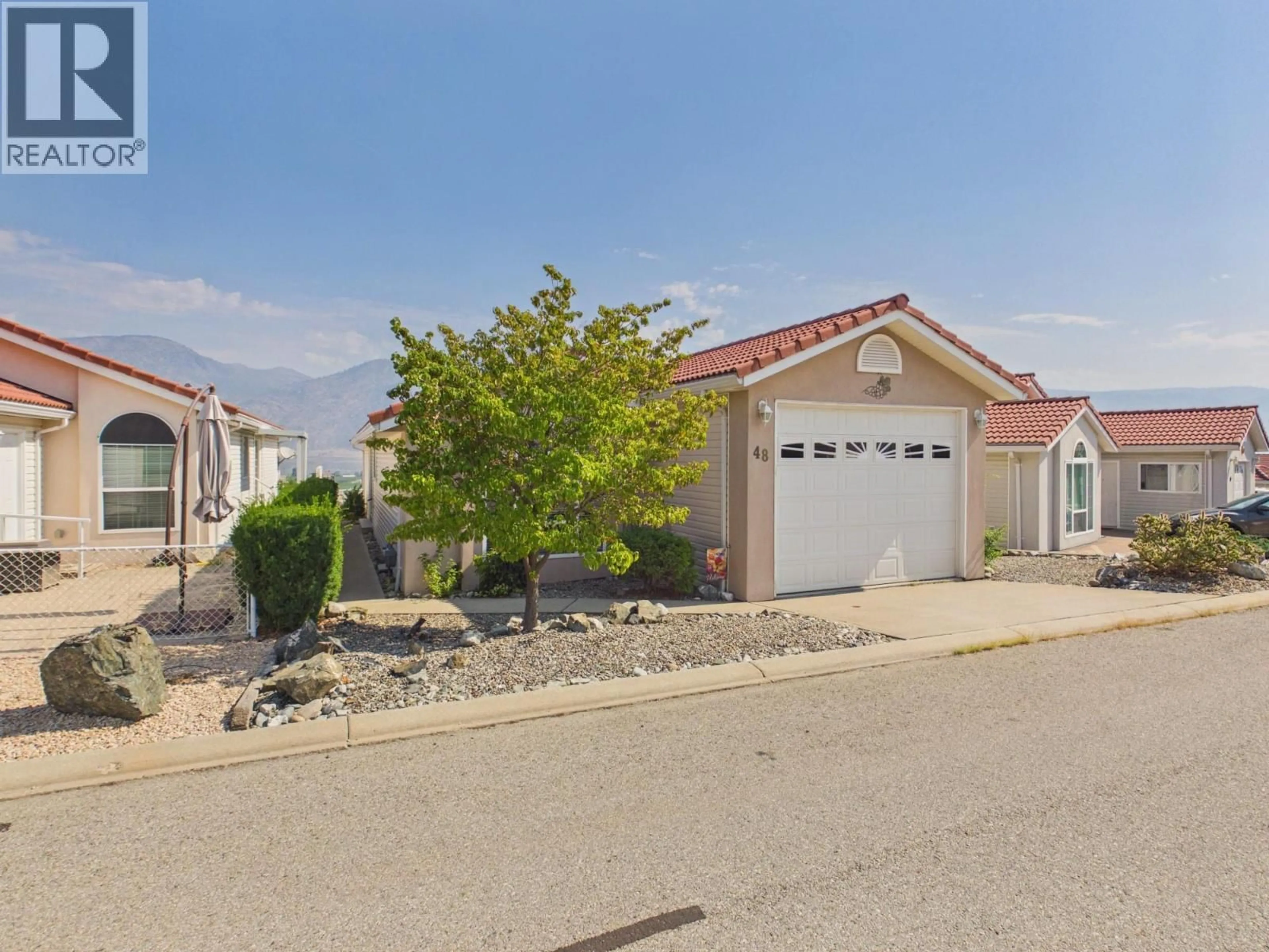 A pic from outside/outdoor area/front of a property/back of a property/a pic from drone, street for 48 - 9400 115TH STREET, Osoyoos British Columbia V0H1V5