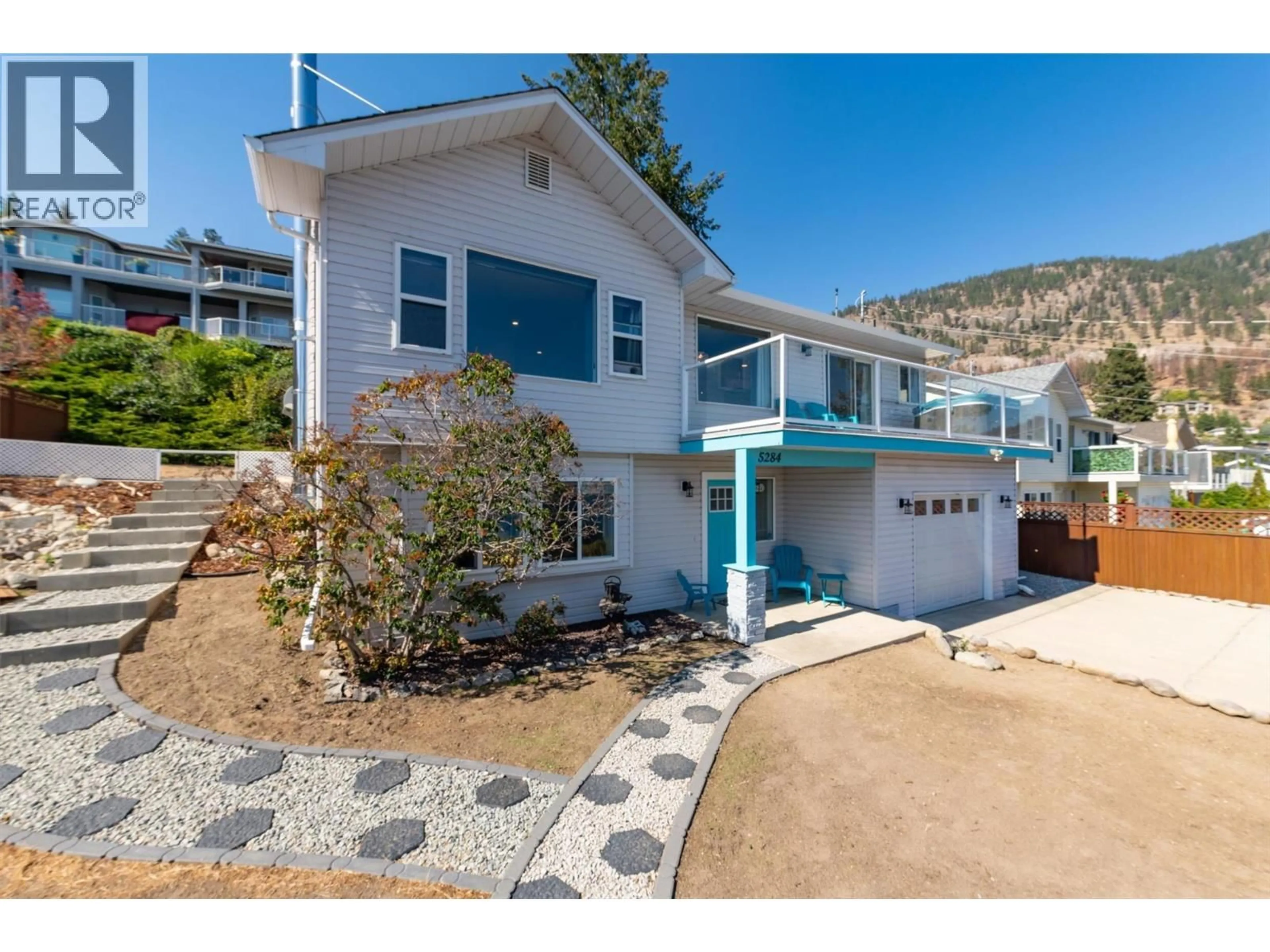 Home with vinyl exterior material, street for 5284 CLARENCE ROAD, Peachland British Columbia V0H1X2