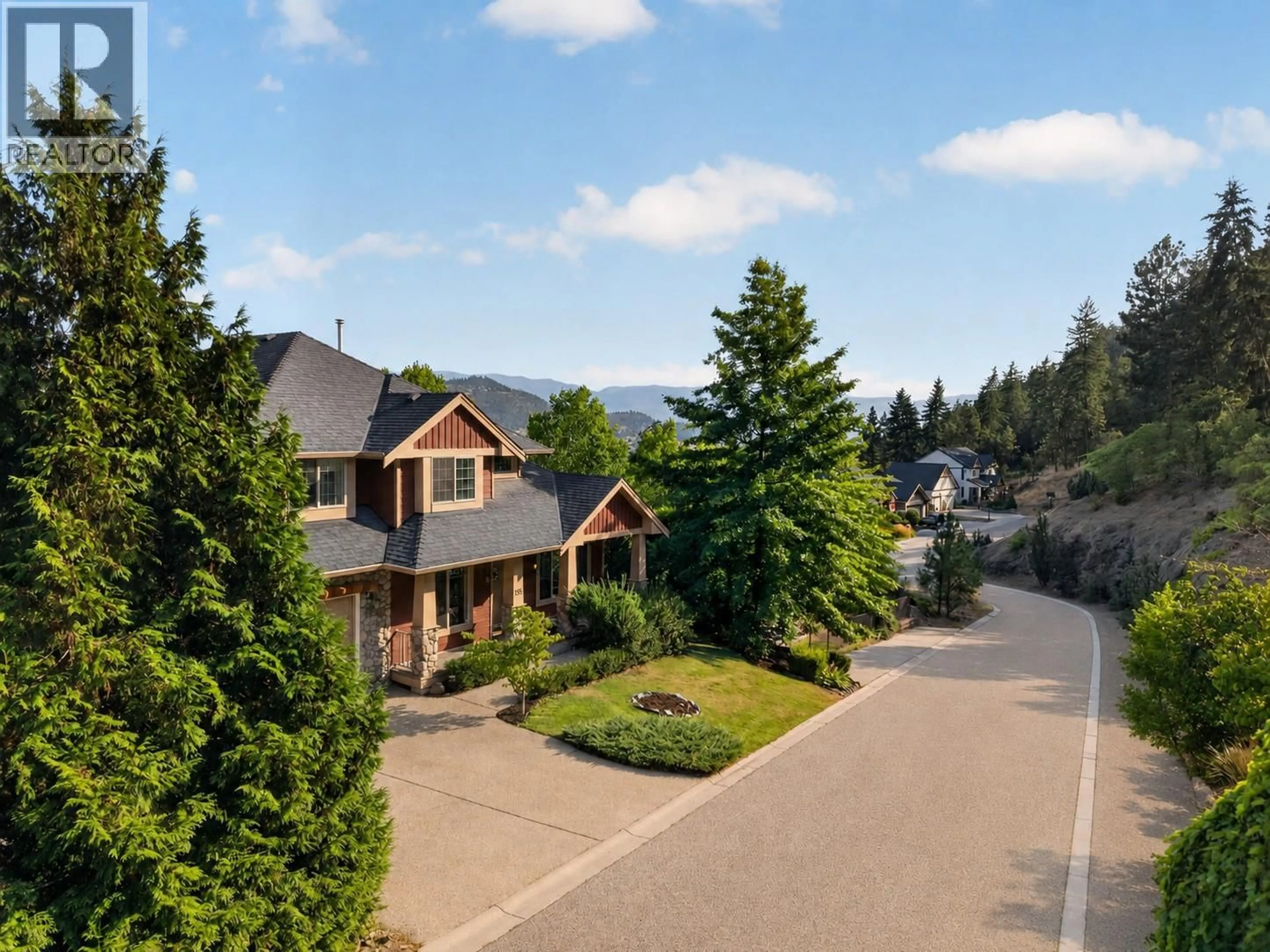A pic from outside/outdoor area/front of a property/back of a property/a pic from drone, mountain view for 155 TERRACE HILL COURT, Kelowna British Columbia V1V2T2
